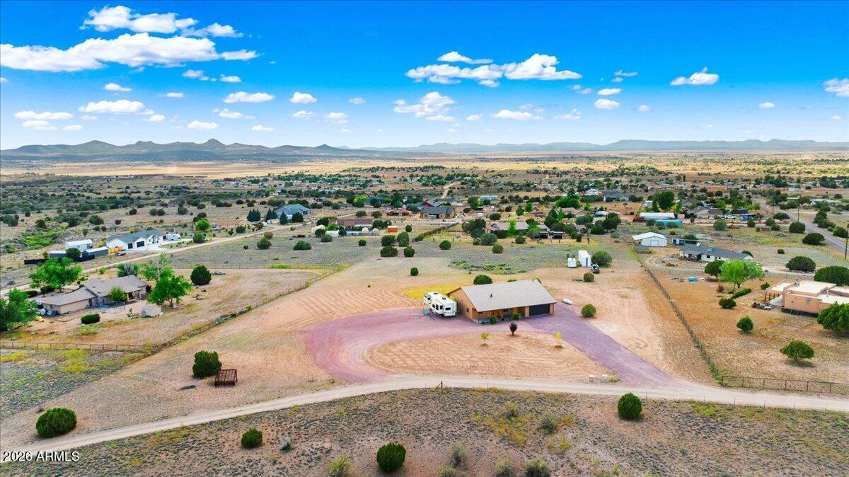Beautiful custom ranch-style home located in a desirable area of Paulden, Arizona, on 4 acres with stunning views and easy access just off paved roads. This custom 1,723 sq ft home showcases exceptional craftsmanship and extensive upgrades throughout.

The interior features custom knotty alder solid-core doors, hand-cut custom trim, wheelchair accessible doors, and a cozy wood-burning stove. The chef's kitchen is designed for functionality and style with custom cabinetry, granite countertops, double ovens, double propane stovetops, and a large walk-in pantry.

This home is equipped with smart WiFi-enabled appliances including the A/C, oven, refrigerator, trash compactor, and water heater. Energy efficiency is a priority with 11-inch polyurethane insulation in the ceilings and garage, a
