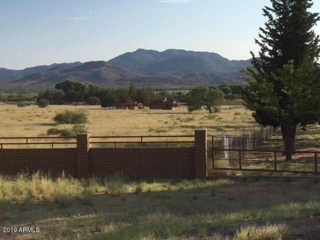 This 900 +/- acre property not only is unique and rare because of its location (35 minutes southwest of Prescott) but it has the key element of sustainability in the state of Arizona and that is WATER. Complimenting this abundance of WATER is 3 PHASE POWER and PAVED COUNTY ROAD access directly to the property. Other improvements include 2 residences, a 7,264 sq ft horse/hay barn with 1 tack room and six stalls with turnouts, a 6,318 sq ft equipment shed/workshop, corrals, perimeter fencing, cross fencing and irrigated pastures. Approximate sq ft range includes 1,004 (ranch home) + 995 (2nd home)=1,999 sq ft, #of Bedrooms (4) and #of bathrooms (1.75) entries includes original home and guest home together.The main ranch home is 1,004 sq ft, 2 bed/ 1 full bath. The guest home is a 995 sq ft. 2 bed/3/4 bath.Live in these homes while you build your dream home in the boulders. This area and land is breathtaking sitting at an ideal elevation of 4,000 to 4,500 feet and is known locally as the upscale and gorgeous ''millionaires row.'' Those who have discovered the beauty of Kirkland, begin a day where they can live life fully and enjoy moderate temperatures all year.