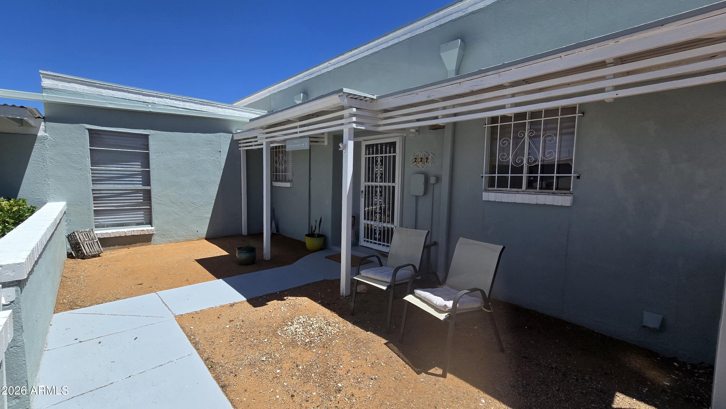 Opportunity to own a furnished 3-bedroom, 2-bath townhome in Pearce with valuable updates already completed and room for the next owner to finish it to their style. This home features brand-new HVAC and plumbing completed in 2023, a functional floor plan, a front courtyard, carport, storage closet, screened-in Porch, and an additional outdoor patio area.  There is also space available for RV parking, though no RV hookups are currently installed.

The home is priced below market value to reflect items that still need completion, including concrete floors ready for tile, carpet, vinyl, or another flooring choice, missing bifold closet doors, and three missing light fixtures/ceiling fans. The seller is not completing these items, giving the buyer an opportunity to customize the finishes. Please note: the property address is on Tracy Road, while the mailbox and Front Door is located on Patio Place. This is a great option for a buyer looking for value, recent major-system upgrades, furnished convenience, and the ability to add their own finishing touches.  Will consider VA & FHA Renovation loans to finish off the flooring.   

All Furniture that is to CONVEY is in the Main parts of the Home -EXPECT in the Bedroom with the Checkerboarded Floors. NONE of these items will Convey