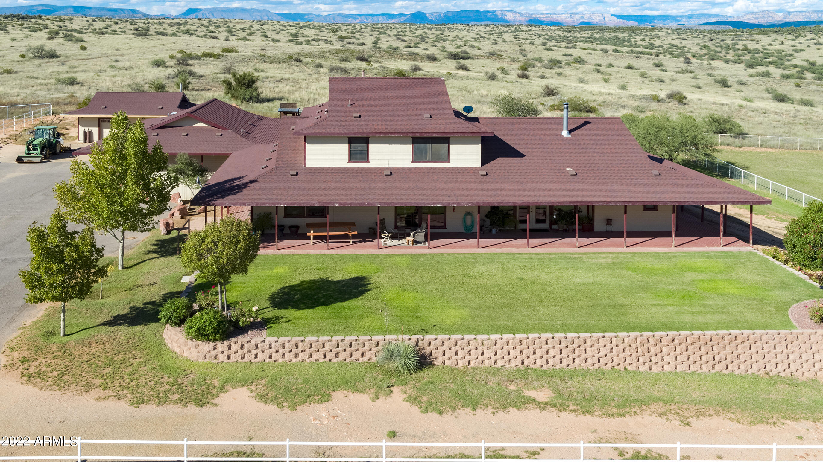 RT Arrow Ranch is a classic Central Arizona horse ranch that invokes a sense of peace & serenity. Ideally located in a tightly held region in the Verde River Valley rich in history & agricultural heritage & only 100 miles from Phoenix. This beautiful ranch consists of a 4 bed/4 bath home w/wrap around porch and sits on 24 acres.  3 car garage with an attached guest suite, creating an additional bedroom. The workshop has 1 parking spot, cabinet/workspace and a wood burning fireplace. The ranch provides for a year round residence or a recreational retreat, ideal for any discipline. Comes complete with 38 stalls, 160 X 300 arena, seven paddocks, 2 irrigated pastures, turnouts, hot walker, 2 round pens, plus much more. The possibilities are endless and there's even room to expand