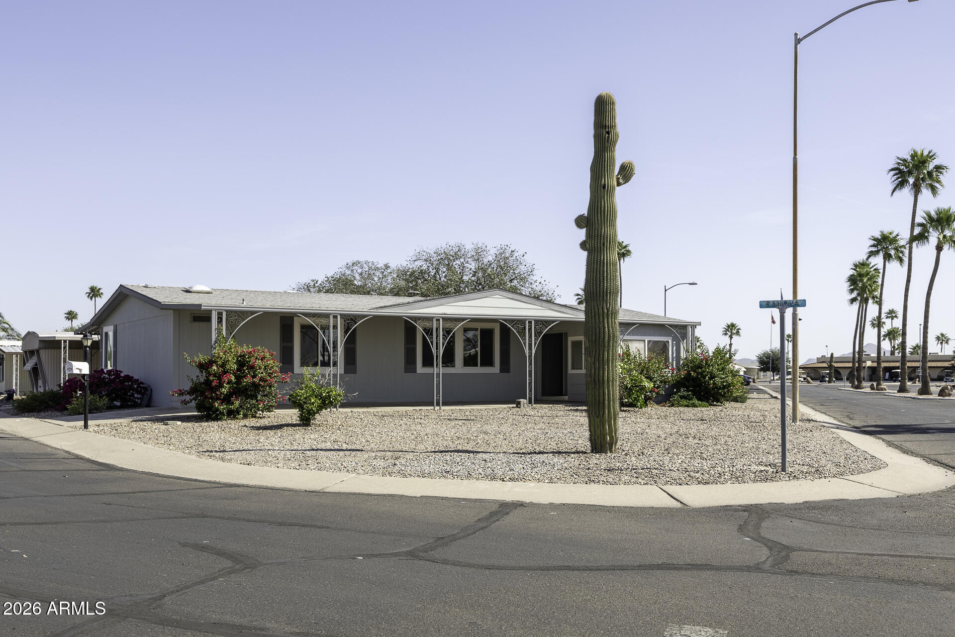 This beautifully and thoughtfully designed 4-bedroom, 2-bathroom home in Casa Verde Estates 55+ offers one of the largest floor plans in the community on a spacious corner lot. With new blinds throughout, fresh exterior paint, a large screened-in Arizona room, a fireplace, a formal dining room, a wet bar, ample storage, and spacious bedrooms, this home will not disappoint! Come and see this beautiful home for yourself and enjoy the Arizona sunshine year round. Casa Verde Estates offers all the trending amenities, plus more. Your new home awaits you!