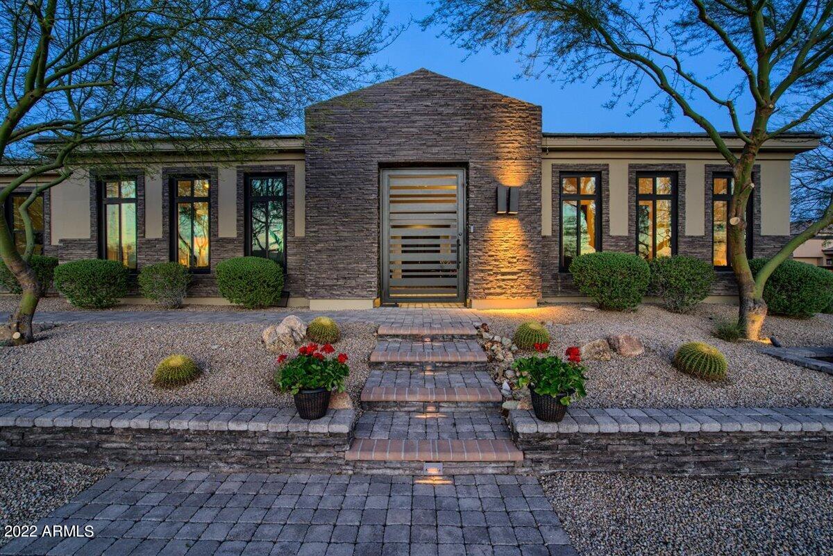Breathtaking mountain views in one the best lots in Pinnacle Peak Place! 36,999 sq. ft. lot. This exquisitely designed semi-custom home inspired by acclaimed award winning architect Piet Boon. Well designed, abundance of living space!  5 bed. 5 bath. plus 2 half baths. Each bedroom has an ensuite.  There is a private entrance in the front to attached casita 1 (bedroom 1)   There is a common living area/ bonus room next to two of bedrooms which can be used for multiple functions unique to each homeowner.  Detached backyard casita 2 has living area and separate bedroom ensuite. Gourmet kitchen with Bosch appliances.