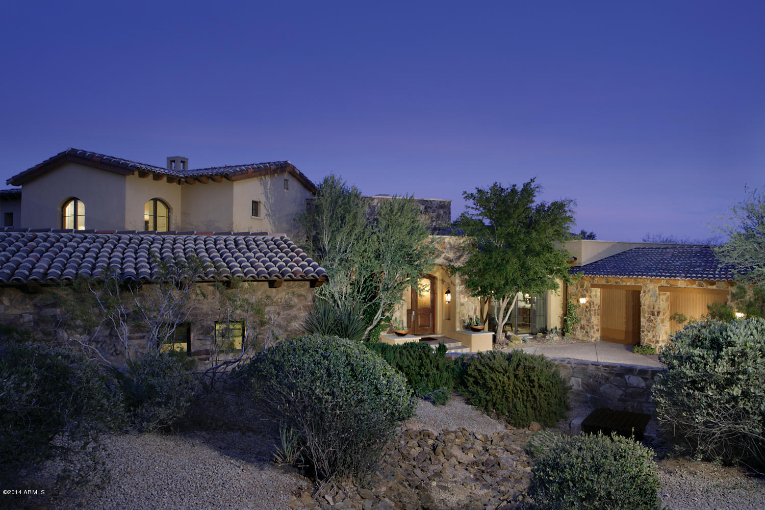 Beautiful custom home located on a double fairway lot overlooking the 14th, 15th and 16th holes of the Estancia golf course.  Incredible views from every room of the house including golf course, Troon mountains and the 4 Peaks.  The living room opens up with a retractable glass door from the entry.  There are 2 oversize master suites, 1 up and 1 down which could also be used as wonderful guest suite. Gorgeous office which has full bath and opens to a courtyard with fountain.  The kitchen opens to the family room with breakfast nook full of windows overlooking patio with outdoor fireplace all located to enjoy the expansive views.  This home was just completely remodeled and fully furnished.Seller willing to trade......