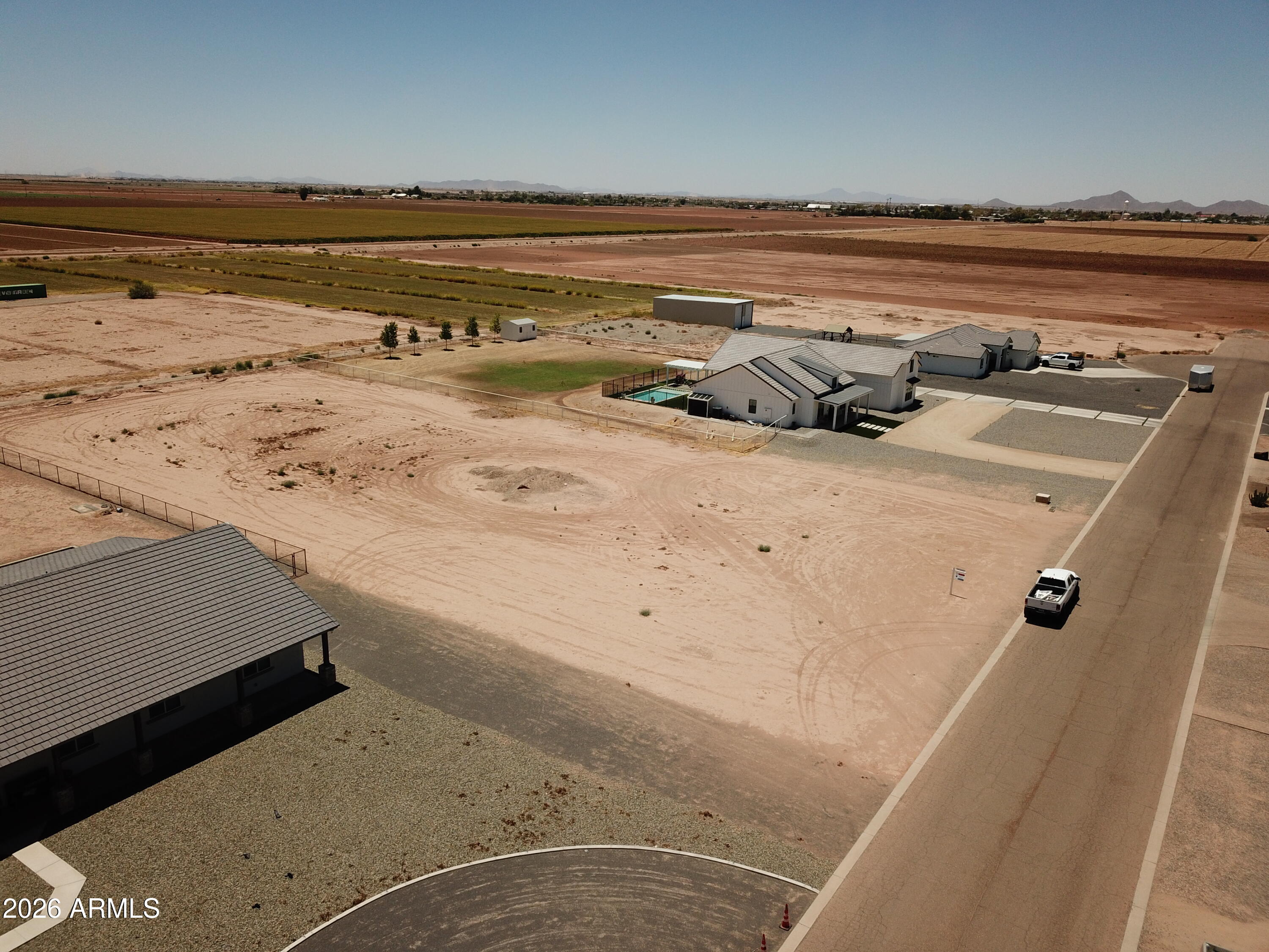 Build your dream home in one of Coolidge's most desirable gated subdivisions, surrounded by beautiful custom homes and wide open desert views. This 1.1 acre lot offers plenty of space for a custom build, RV garage, pool, workshop, or outdoor living area. Enjoy mountain views, privacy, and the peaceful feel of a prime custom home community while still being close to town conveniences. Water and ED2 power are available to the property. Buyer to install septic system. A great opportunity to secure land in a highly sought-after neighborhood with room to create the lifestyle you've been dreaming of.