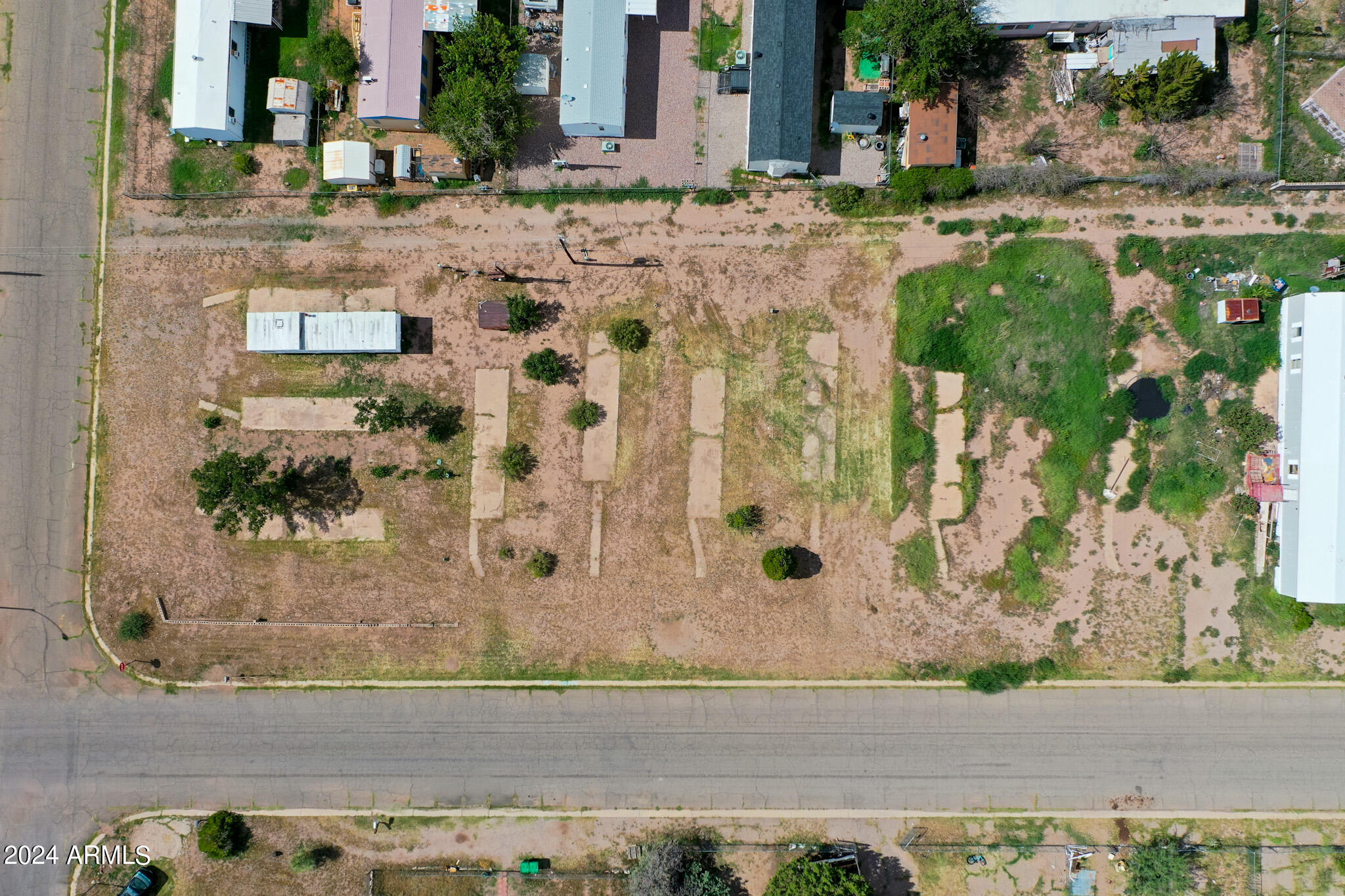 EXCELLENT OPPORTUNITY for investors. 1/2 ACRE Zoned Multi-family/Residential. This is one of 2 lots available (300 E Pima St (MLS #6744651). Property being sold AS IS. Huachuca City will NOT allow for any mobiles home to be installed or to be put back in service for occupancy.  Utilities are at the property but must be confirmed depending on the desired development.