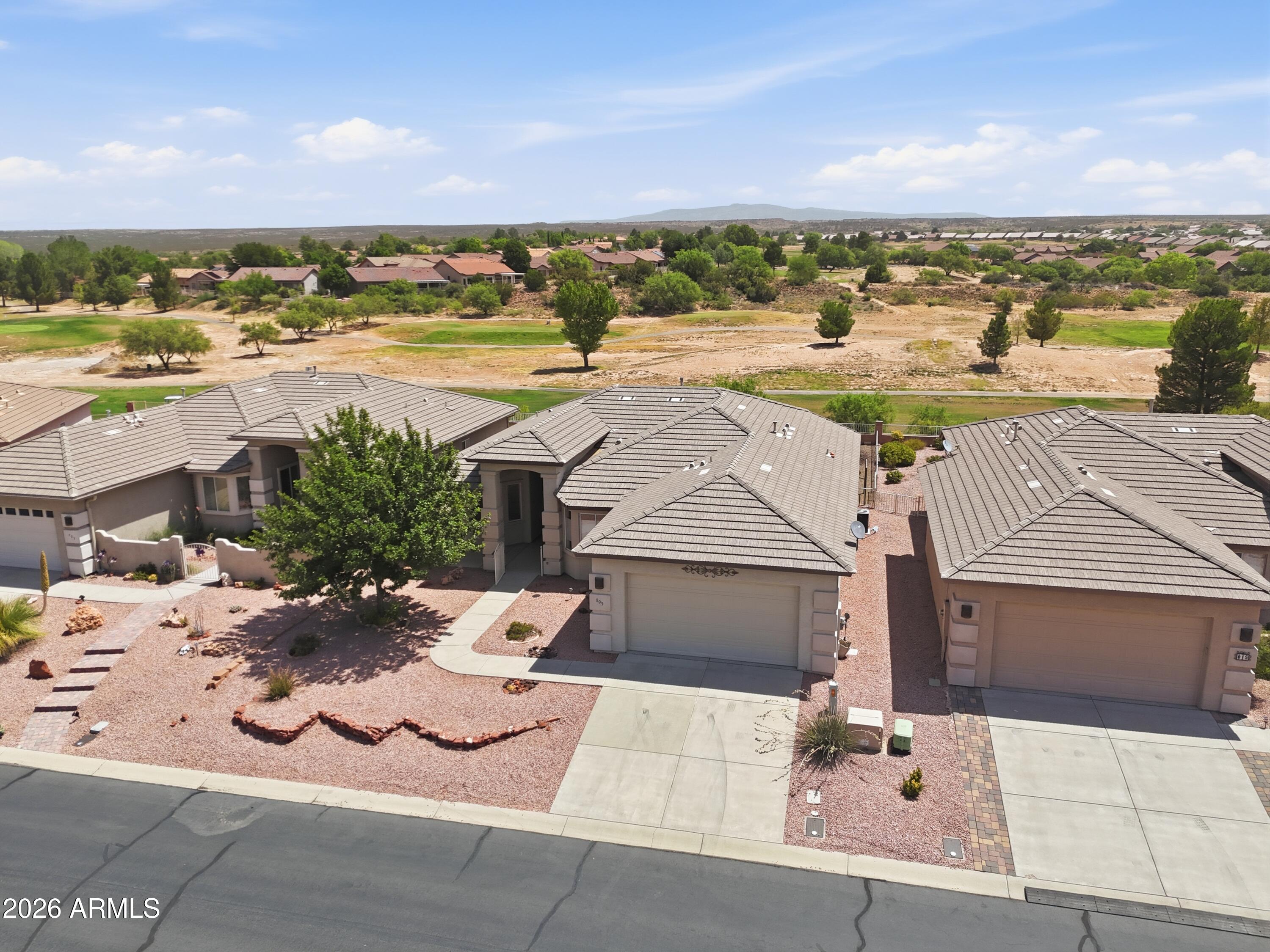 This home offers an excellent location by the golf course, featuring 2 bedrooms and 2 bathrooms with a well-designed floor plan. The living room provides stunning views of the golf course, while the kitchen is a chef's dream, boasting ample cabinets, counter space, and an island, along with an electric cooktop and built-in oven. The dining room features beautiful views of Mingus Mountain and is perfectly sized for gatherings. The master suite is spacious, equipped with a gorgeous bathroom that includes an oversized tile shower and a dream closet. Additionally, a flex room presents options for a den, office, hobby room, or potential 3rd bedroom. This property is located in a gated community on a scenic lot.