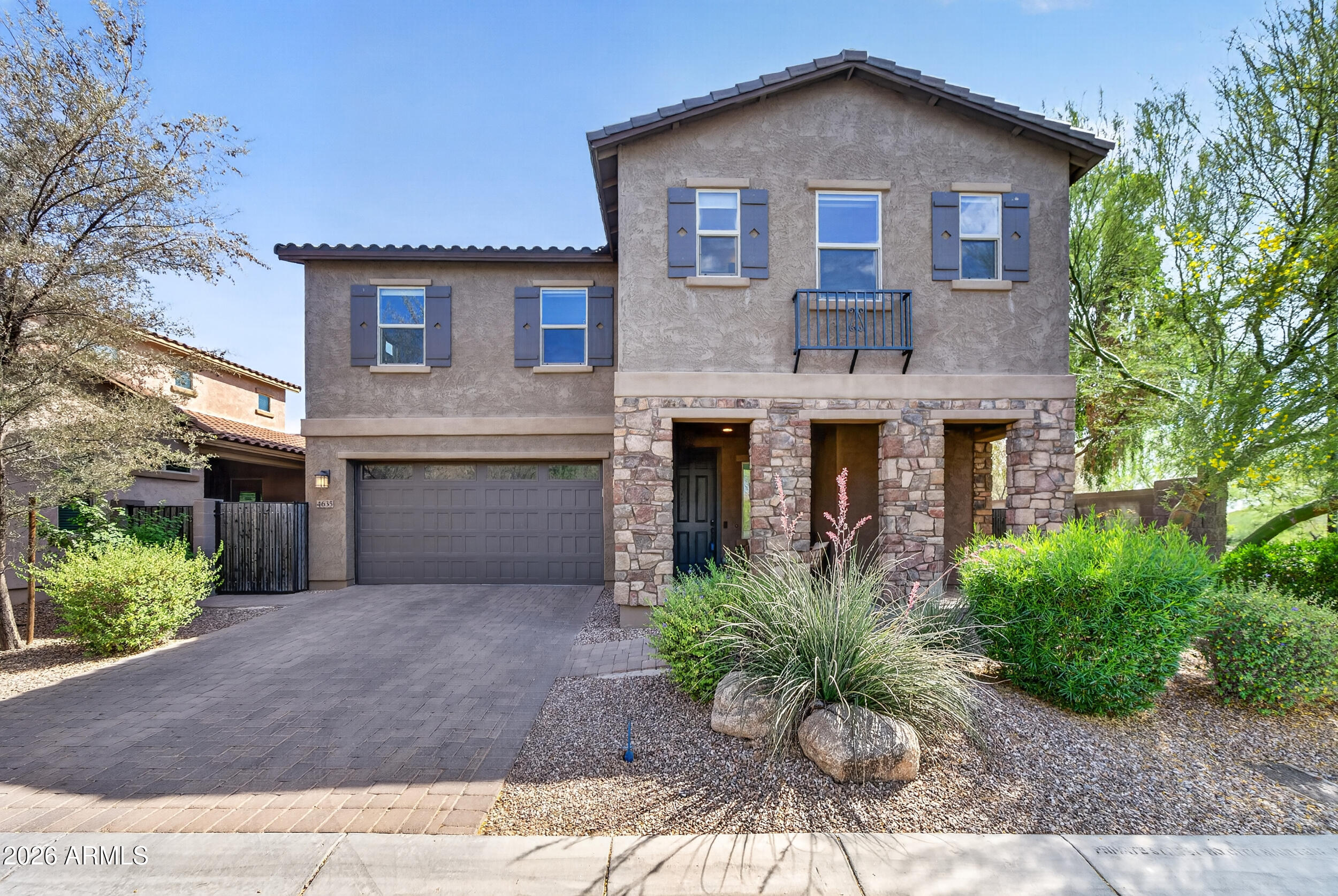 Beautifully maintained Taylor Morrison home in the prestigious Sanctuary community in the heart of Desert Ridge. Newer home (built in 2016) and move-in ready with tons of upgrades including a recently updated kitchen and new custom shutters. Home sits on a premium end-lot adjacent to the Yavapai trail and just a short walk to the Sanctuary clubhouse, fully equipped fitness center, and resort-style heated pool. The primary suite offers tons of space, two closets, separate double sinks and an oversized shower. Three additional generously sized bedrooms (one with its own en-suite), large loft, 9 ft ceilings, decorative paver front porch and driveway, stacked stone elevation, low maintenance backyard with brand new synthetic grass, newer tankless water heater, custom overhead garage storage, and much more. Easy access to both the 101 & 51 freeways and close to Desert Ridge Marketplace and top-rated schools.