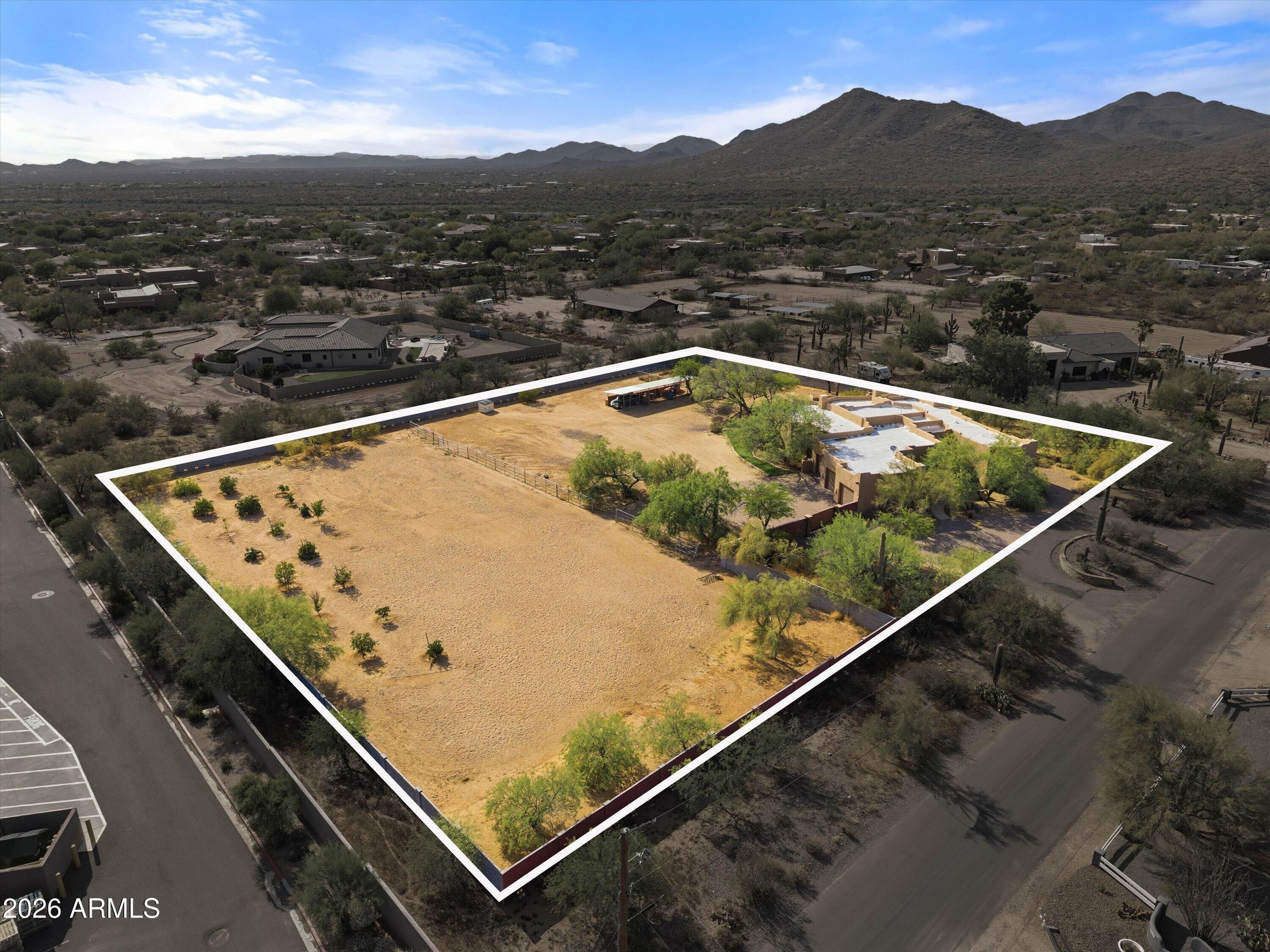 Located in a prime Cave Creek location on 2.5 acres, this updated custom Territorial home offers the perfect mix of privacy, convenience, and Arizona lifestyle living. Enjoy mountain views, stunning sunsets, and direct access to miles of hiking, biking, and horseback riding trails, all while being within walking distance to local amenities.
Recent upgrades include a new 6-ft block wall surrounding the entire property, luxury vinyl flooring throughout the main living areas, new carpet in the bedrooms, new baseboards, custom master closet built-ins, new automatic blinds, and new leach lines.
The open floor plan features warm finishes, quality cabinetry, granite countertops, stainless steel appliances, and a new refrigerator. Flexible layout offers 3 bedrooms plus a large office, theatre ro , optional 4th bedroom with separate exterior entrance--ideal for guests or a private workspace.
The backyard is built for entertaining with a Pebble Tec pool, new Bullfrog above ground hot tub, spacious covered patio, outdoor kitchen with sink, grill, refrigerator, and fireplace, all positioned to take in the views. There is also a beautiful garden & orchard with citrus and plum trees!
Equestrian amenities include a 3-stall mare motel and a large 219' x 107' arena with room to rope, rein, or team pen. Circular driveway, RV parking, and plenty of room to add an RV garage complete this exceptional property. Roof just recoated (June 2026), New AC (June 2026) and new leach field for septic (2026).