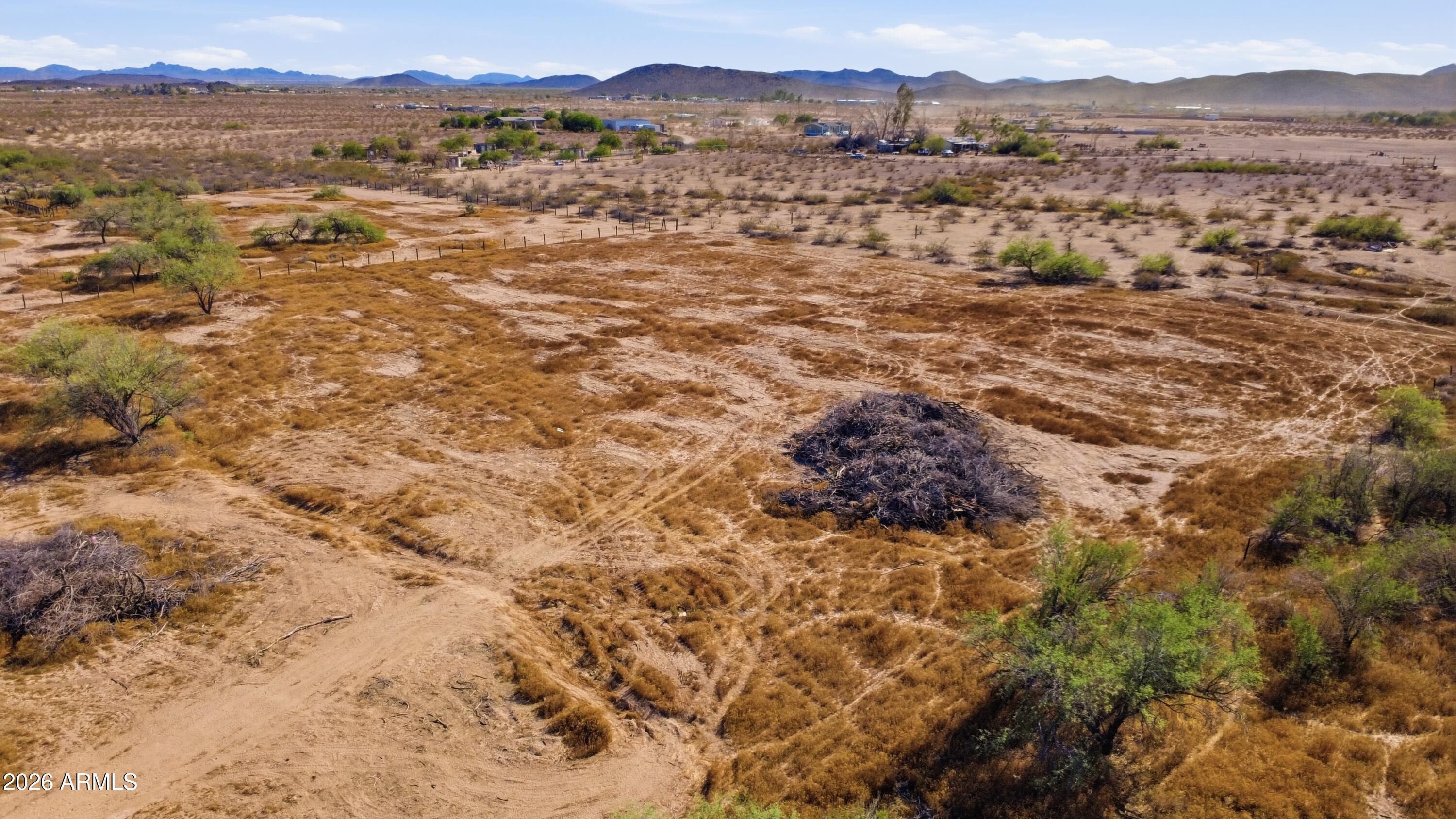 2.5 acres of open West Valley land, larger than most parcels available in the area. Ample room to build a home or set a manufactured home, with space remaining for a shop, garage, or corrals. Suitable for horses and plenty of room for your toys. No HOA, and convenient access to I-10.