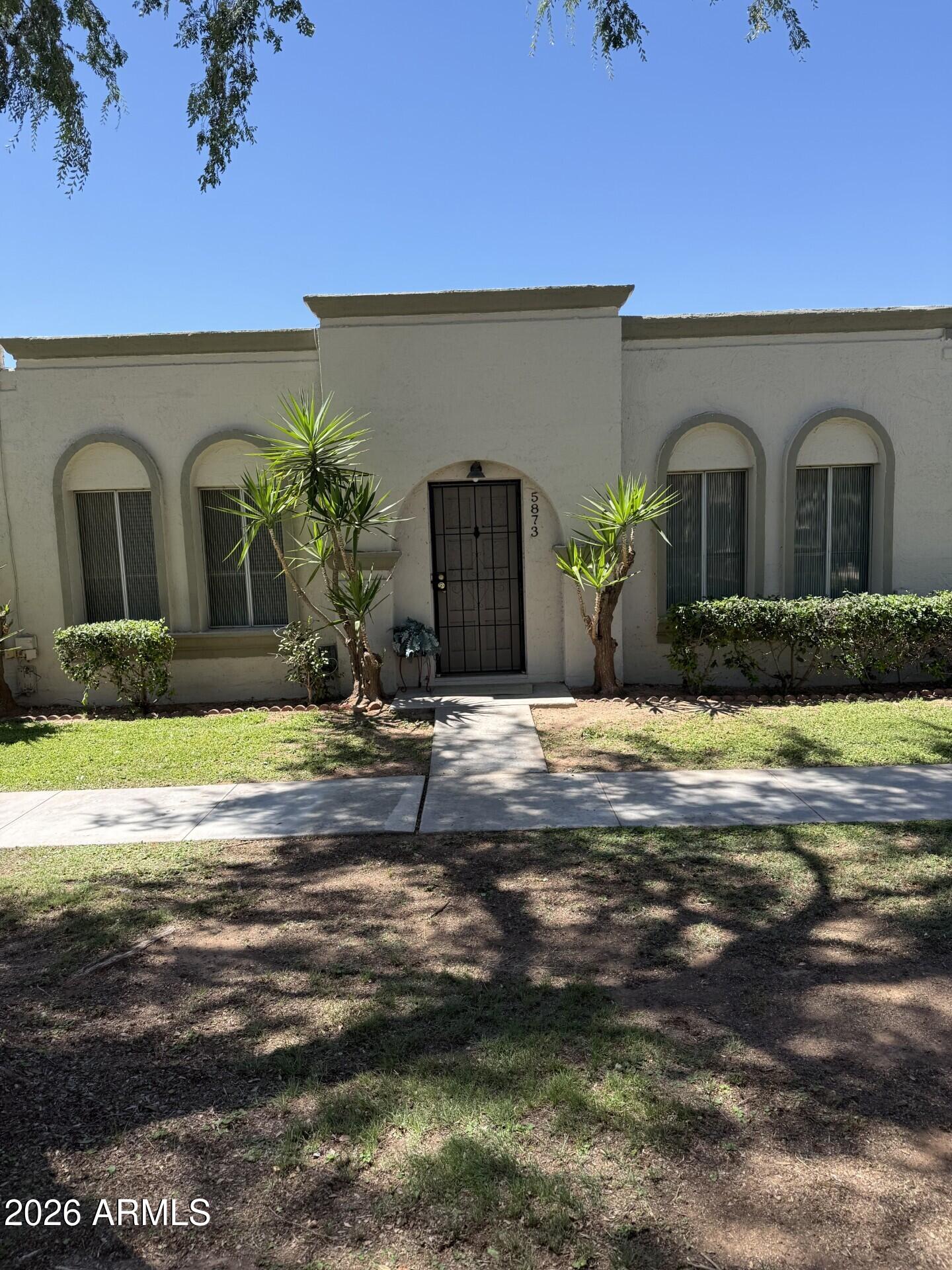Extremely well located and affordable single level Scottsdale townhouse. 3 Bedrooms, 2 baths, wood look laminate flooring throughout, separate storage unit in carport area, 3 assigned parking spots! Outside storage area.