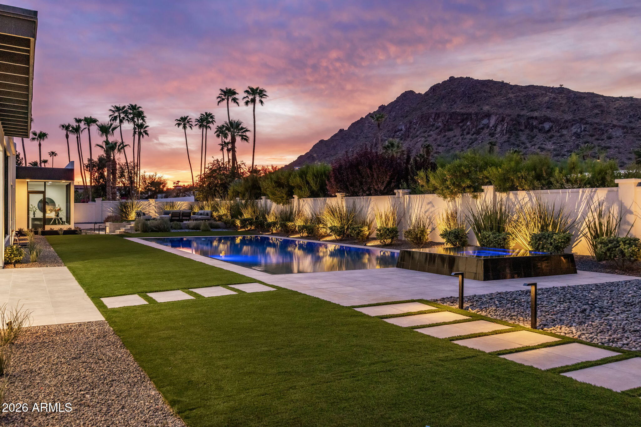 Arcadia meets PV, just completed: 2026 completely reimagined. Jawdropping walls of glass w/unobstructed views of Camelback Mtn. 6 ensuite BRs (each w/walk-in closets) + ensuite office + flex rooms, 8 Bathrooms. All hard floors, wide-plank oak wood, high ceilings, wide hallways, fabulous layout. Gourmet kitchen Wolf/Subzero/Cove/Miele w/back-kitch butler pantry -- double oven, 3rd dishwasher & sink w/passthru to outdoor kit, all designed by a chef. 6 Subzeros in this home, guests will never go thirsty! Detached ensuite ofc w/15' flr-to-ceiling glass wall w/Mountain & Bkyard views -- ideal Pilates studio or 7th ensuite BR. 5-car gar; plans to add 5 more. Custom pool 10' deep. Raised Hottub. Camelback views. Outdoor kit w/TV pavilion seating. Arcadia-style front patio w/firepit. Rear fire pit under the gaze of Camelback. Walk to Cholla trailhead & the Phoenician. Under 1 mile to Scottsdale Fashion Square & Old Town Scottsdale. Arcadia School District. Scottsdale address. PV location. First time to market. A must-see.