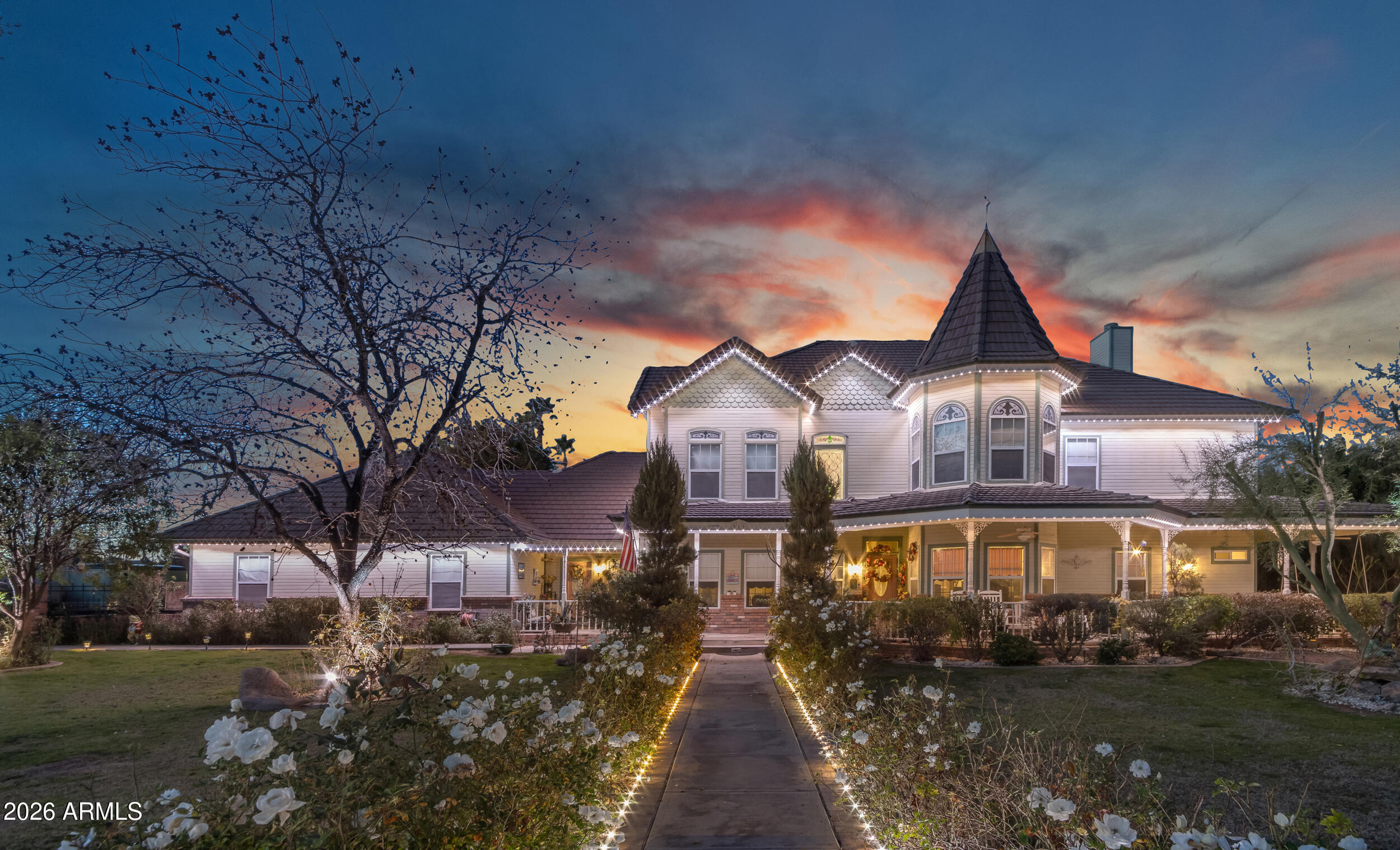 Nestled in the heart of South Tempe, this Victorian estate blends old-world craftsmanship with modern convenience. From the enchanting tower to the finely detailed roof peaks, this architectural masterpiece radiates a sense of timeless grandeur--yet behind its stately presence lie surprises that will leave you in awe. With 10 bedrooms and 7.5 bathrooms, the main residence is designed for more than just living--it's meant to be experienced. Sunlight pours through oversized windows, illuminating expansive living spaces that invite both intimate conversations and grand celebrations. But the magic doesn't stop there. A detached guest house offers 2 additional bedrooms, a full kitchen, laundry, and a private living area, creating a self-contained retreat for guests, extended family, or even a hidden creative escape.
Venture outside, and you'll find a backyard sanctuary unlike any other. A shimmering pool and spa invite relaxation, while a built-in BBQ and pergola seating set the stage for unforgettable gatherings. As the sun sets, the warmth of the outdoor fire pit and fireplaces creates an inviting atmosphere, perfect for storytelling, laughter, or simply soaking in the peaceful surroundings. The lush landscaping enhances the sense of seclusion, but within this private paradise, there are unexpected details secrets of the home that can only be discovered in person."