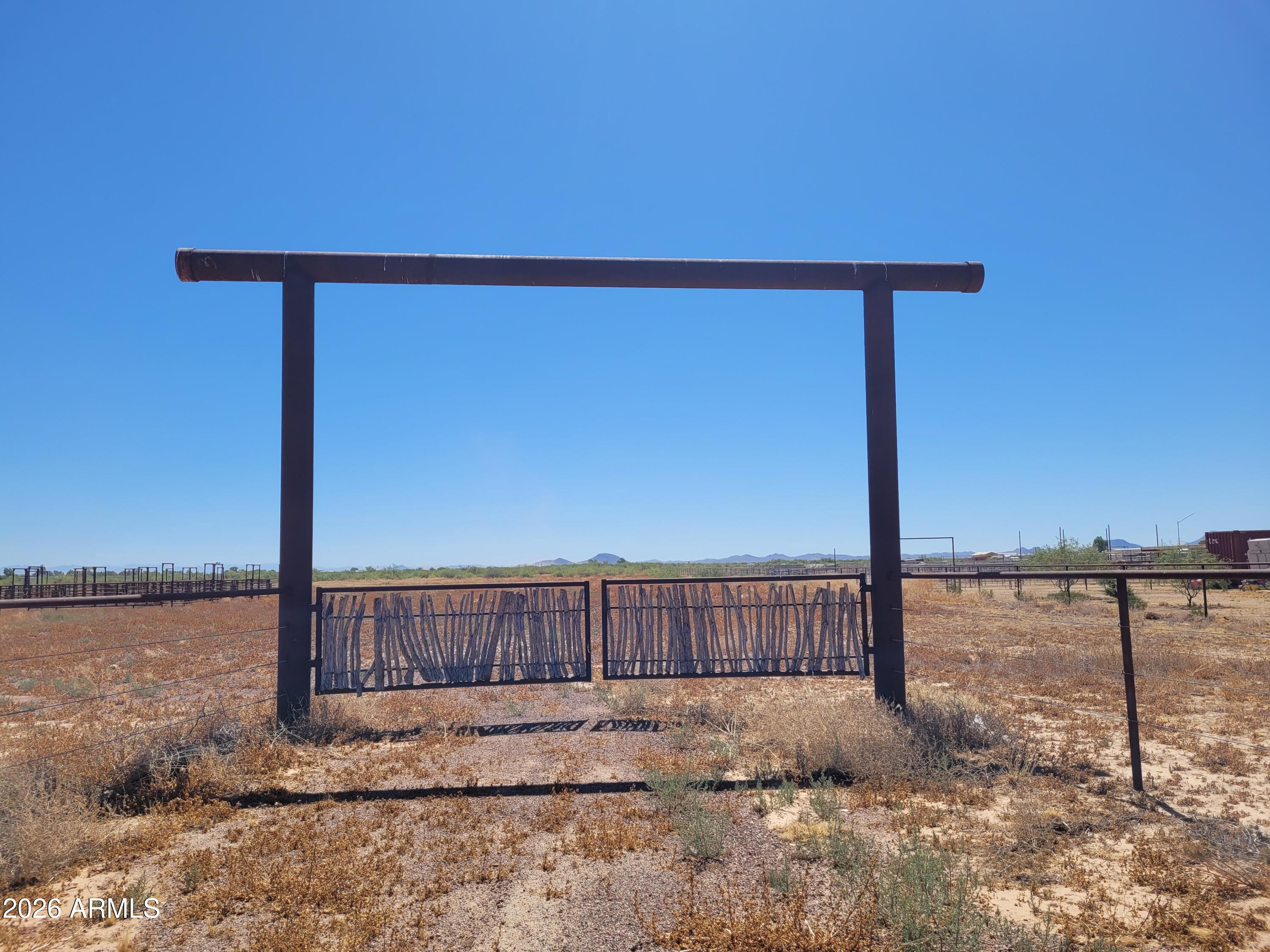 Positioned along paved Eagle Eye Road in the growing rural community of Aguila, this exceptional 10-acre property offers a rare combination of equestrian infrastructure, accessibility, and future potential.

Designed with horse owners, trainers, and investors in mind, the property is fully enclosed with quality pipe-and-cable fencing and features 32 horse stalls, each equipped with individual waterers. Highly sought-after city water service is already in place, eliminating one of the most significant challenges and expenses often associated with rural Arizona properties. Substantial site improvements have already been completed, creating a property that is immediately functional and ready for use. Approximately seven acres have been professionally cleared and grubbed, providing open, usable ground for horses, trailers, equipment, future structures, or additional development. The site has also been leveled and enhanced with approximately $15,000 in imported gravel, creating excellent all-weather access and maneuverability for horse trailers, RVs, trucks, and heavy equipment.

Whether envisioned as a private horse facility, boarding operation, training headquarters, seasonal equestrian retreat, RV base, or long-term investment, the possibilities are extensive. The property's location offers convenient access to the renowned Wickenburg horse community while maintaining the wide-open spaces, mountain views, and rural lifestyle that continue to draw horse enthusiasts and investors to the Aguila area.

Unlike many vacant land offerings, this property represents more than acreage--it represents years of planning, infrastructure investment, and site preparation already completed. The next owner can step in and immediately begin using the property rather than spending months and significant capital developing raw land.

Property Features
- 10 acres with paved road frontage along Eagle Eye Road
- Complete pipe-and-cable perimeter fencing
- Desirable city water service
- 32 horse stalls with individual waterers
- Approximately 7 acres cleared and grubbed
- Professionally leveled site
- Approximately $15,000 in gravel improvements
- Excellent access for horse trailers, RVs, and equipment
- Strong equestrian, recreational, and investment potential
- Located in one of Arizona's most desirable emerging rural markets

Opportunities to acquire a property this size, with this level of infrastructure, water availability, and accessibility are increasingly difficult to find. Whether your vision includes horses, recreation, business use, or long-term land investment, this Eagle Eye Road property is positioned to deliver immediate utility and lasting value.