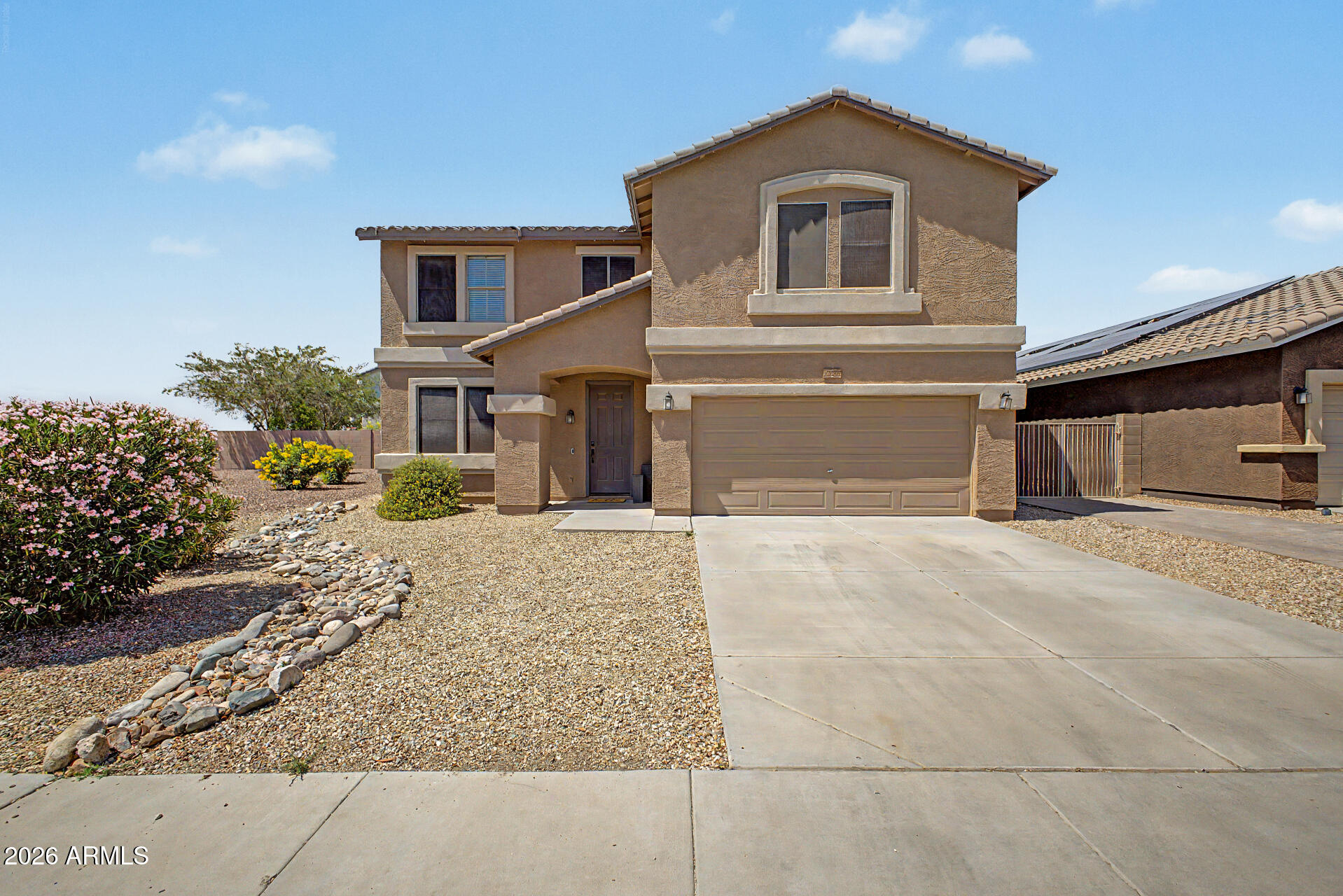 NOT A 55+ COMMUNITY! This gorgeous remodel showcases designer touches at every turn. Offering more than 3,400 square feet, the expansive floorplan features exceptional room sizes and thoughtfully designed spaces for every member of the family. Enjoy two spacious living areas perfect for entertaining, a beautifully updated kitchen and dining area overlooking the backyard, an enormous loft, private office, four oversized bedrooms, a truly one-of-a-kind laundry and 2.5 fully remodeled baths. Space is never in short supply in this incredible home.

The stunning kitchen has been completely refreshed with a crisp, modern aesthetic featuring an oversized island, newly constructed pantry with abundant storage, stainless steel appliances, gorgeous quartz countertops, and a custom-built dining bench. 

The oversized primary suite easily accommodates a seating area or reading nook offering a private retreat after a busy day. Its luxurious bath is equally impressive, highlighted by a walk-in shower spanning the full length of the room with 12 body sprays, a ceiling-mounted rainfall head, and handheld sprayer. The expansive walk-in closet has also been upgraded with custom built-ins.

The secondary bedrooms are exceptionally spacious, with walk-in closets in two of the three rooms. The beautifully remodeled hall bath features a trough sink, quartz countertops, a new tub and surround with bold ceramic accents, along with updated fixtures, faucets, and lighting. 

Recently painted and enhanced with millwork accents throughout, this marquis home truly rises above the rest. Gorgeous flooring flows seamlessly throughout creating a neutral yet striking palette. Simply put, no detail has been overlooked....From ceiling fans, lighting, all bath, kitchen & plumbing fixtures, countertops, vanities & cabinetry, door knobs & hardware, custom millwork featuring shiplap, board & batten plus a custom designed cabinet in the luxurious laundry & a redesigned half bath for guests... this beauty shines.

Step outside to enjoy the covered patio and serene backyard surrounded by mature trees that provide both shade and privacy. Crisp artificial turf completes the outdoor setting allowing a green backdrop for fun and relaxation. With no neighbors to the west, you'll enjoy breathtaking sunset views each evening and privacy galore, as this home is ideally situated at the end of a cul-de-sac. 

Near shopping at the 4 Corners with every restaurant, shop & banking you will ever need, Lake Pleasant Regional Park, Paloma Park with it's walking paths, lake & outstanding children's playground & greenbelts, theater, TSMC plant, P83 Entertainment District, The 101, 303 and I-17 freeways... you name it & it's at your fingertips. Buyer to verify all information