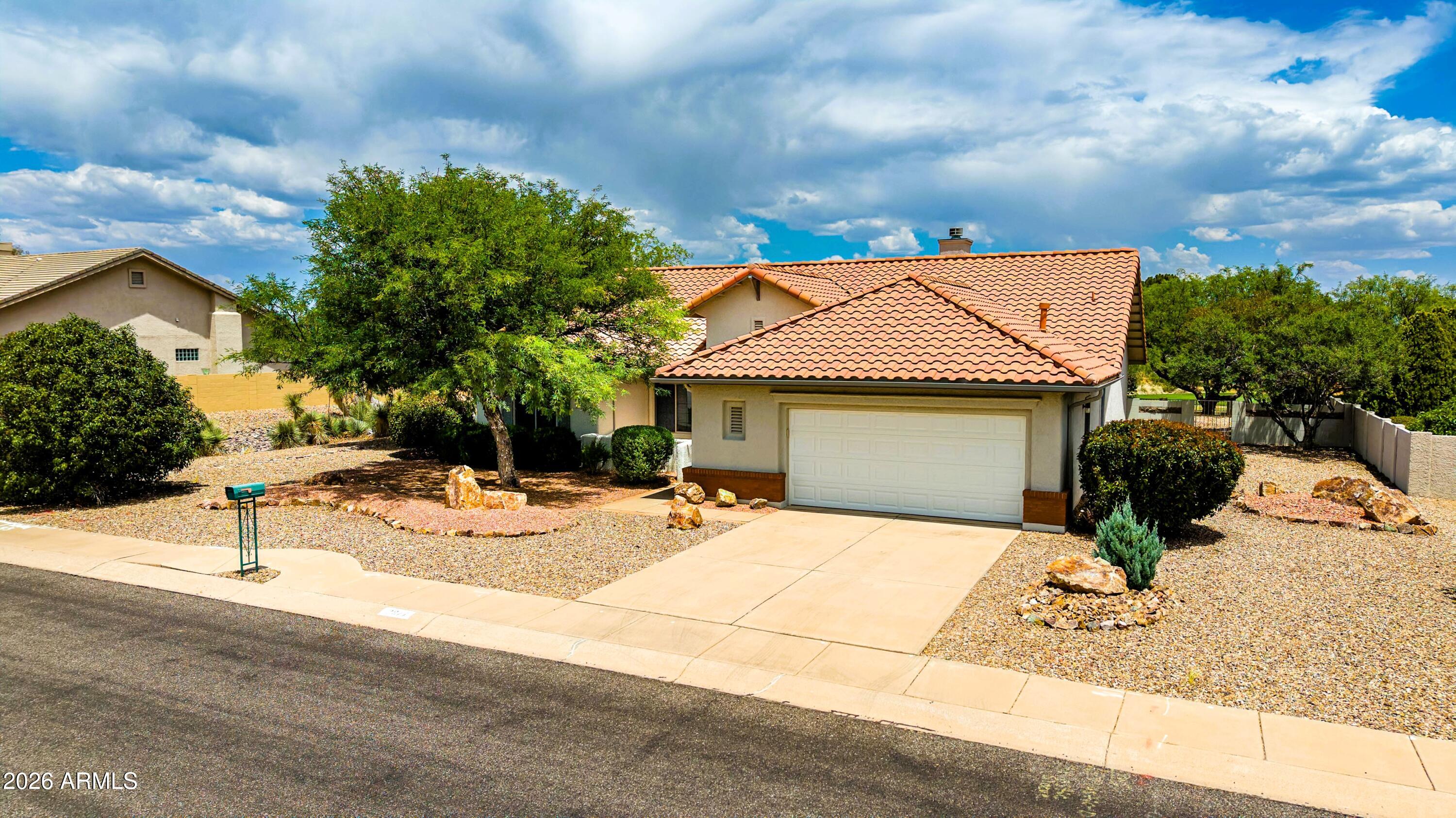 This is the one! A move-in ready Sedona model in the desirable 55+ gated community of Winterhaven, offering a split floorplan with 2 bedrooms, 2 baths, and a versatile study/den. A beautiful built-in bookcase separates the living room from the spacious kitchen & dining room, creating a uniquely defined layout. There is new flooring throughout most of the home, Anderson windows with newer treatments, fresh interior & exterior paint, and a newly upgraded roof. The living room features a stunning fireplace with Turkish tile, and the large primary suite includes a remodeled ensuite bath and walk-in closets. Relax in the fully enclosed patio or on the welcoming back terrace overlooking one of Winterhaven's largest yards- complete with fruit trees, flowering bushes, and view of the golf course.