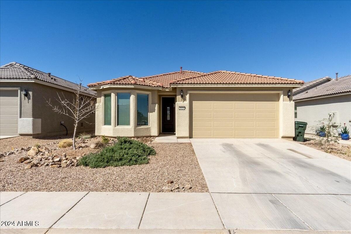 Welcome home to this nearly new home that offers 4 bedrooms, 2 bathrooms, ideally located with no neighbors directly behind home.  No HOA! The interior of the home features: bay windows, wood look tile in all areas, excluding bedrooms which features upgraded carpet & pad, 36'' upgraded cabinets with quartz countertops in the kitchen, executive height countertops in bathrooms with matching quartz countertops & upgraded bathroom mirrors, water softener, neutral shades, updated light fixtures,  and more!  The exterior features a landscaped, low maintenance front yard on drip system. The backyard has artificial turf, raised garden beds all on a watering system. This one is ready to be your home!