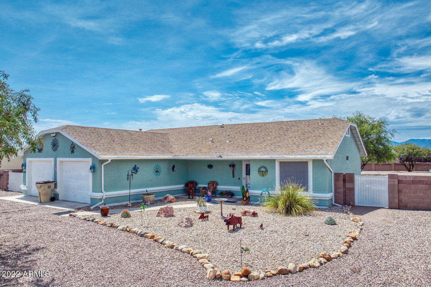 Need some space?  This super cute 3 bedroom 2 bath split floor plan on .713 acres with backyard fully fenced with a block wall offers that and MORE!  This 1541 sf home boasts pride of ownership.  NEW exterior and interior paint, NEW stainless steel appliances, NEW lighting and fans throughout, NEWER wood-look laminate flooring, NEW kitchen sink and faucet, NEW kitchen backsplash, NEW dual flush toilets, and NEW window treatments throughout!  The garage is oversized and ''boat ready'' with lots of cabinets and shelves for storage.  Have an RV??  No problem, there is and RV gate and plenty of room for parking.  The back has both covered and uncovered patio's to enjoy our beautiful Arizona sunrises and sunsets!  This is a slice of heaven on earth!  Come see for yourself.  Call to view today.