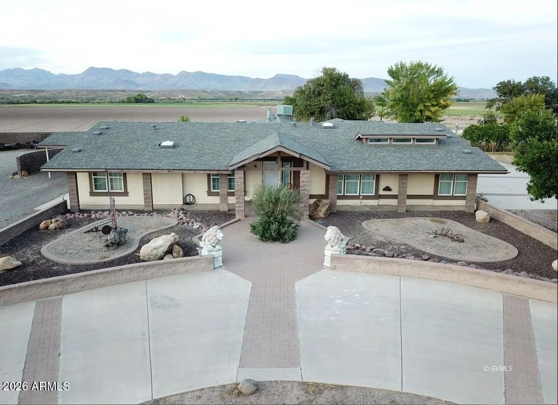 Welcome to a rare high-performance estate designed for those who demand both luxury and industrial-grade utility. Situated on 2.2 private acres, this expansive compound features a fully updated 3,800 sq. ft. main residence boasting 4 bedrooms and 3.5 baths. The massive 880 sq. ft. Master Wing serves as a private sanctuary with dual walk-in closets and a secluded porch. Outdoor living is elevated by a 500 sq. ft. home gym and a raised lookout deck providing breathtaking 360-degree mountain views.
The property also includes an amazing 800 sq. ft. independent guest house, fully self-contained with a full-size kitchen and open living area--perfect for multi-generational living or a high-end rental. For the professional or hobbyist, the heavy-duty 40'x60' shop features 20-foot ceilings, a hydraulic lift, and a welding station. With updated HVAC systems (2022), a new well pump (2023), and dual septic tanks, this turn-key compound offers unmatched infrastructure and versatility.