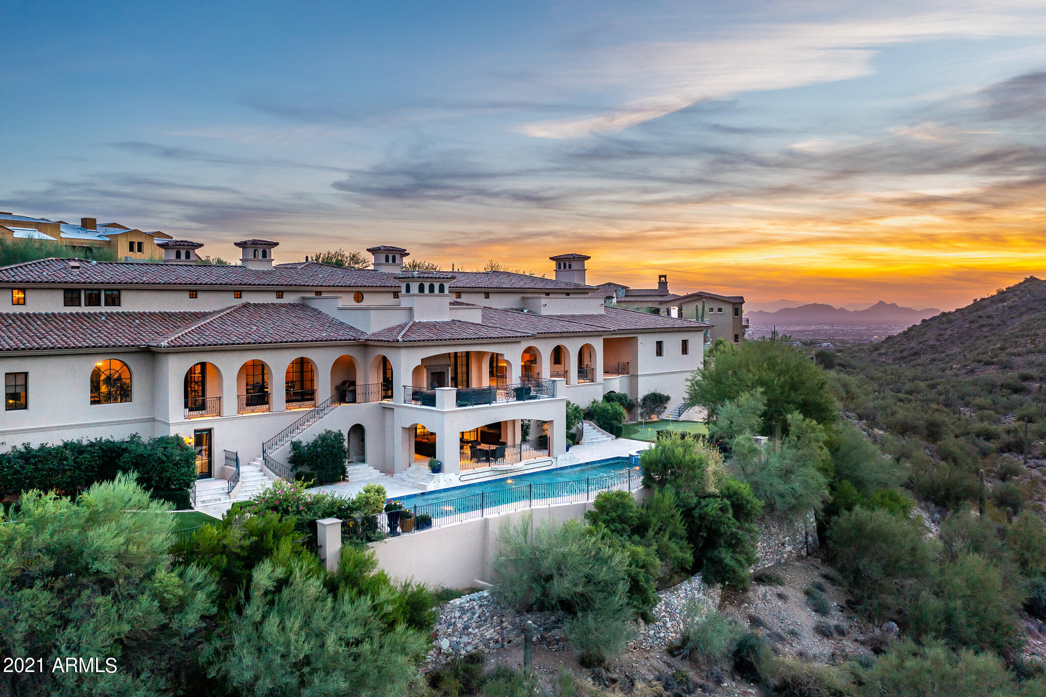 Spectacular Mediterranean estate in the Upper Canyon of Silverleaf. Meticulously designed with handpicked finishes, no detail was overlooked, from vaulted cross beamed and coffered ceilings, rich wood cabinetry, huge walk-in closets with boutique style built-ins, imported stone counter tops and large living spaces for entertaining and retractable and sliding doors to access veranda patios that take advantage of our amazing Arizona outdoor living! Additionally, the den, wine room, bonus area/ loft, and upper deck with fireplace are perfect for smaller gatherings. This 14,512 SqFt home, with 7 bedrooms and 6.5 baths, maintains a wonderful feeling of home, and features a gourmet kitchen with top-of-the-line appliances, an additional entertaining kitchen, two islands for prep space and...MORE breakfast bar, and commercial sized refrigerator and freezer. The master suite is in its own wing with a private sitting room and dual sided fireplace, deluxe bathroom with a stunning bathtub, dual walk-in closets, an office/den, 2nd level exercise room and view deck. The additional bedrooms are split from the master wing, each with their own bathrooms and closets. This magnificent home is literally surrounded by mountains and offers something for everyone, including a lovely pool and spa, putting green, theater room, entertainment room, multiple outdoor sitting areas, and an outdoor shower. Silverleaf Golf Club Membership may be available.