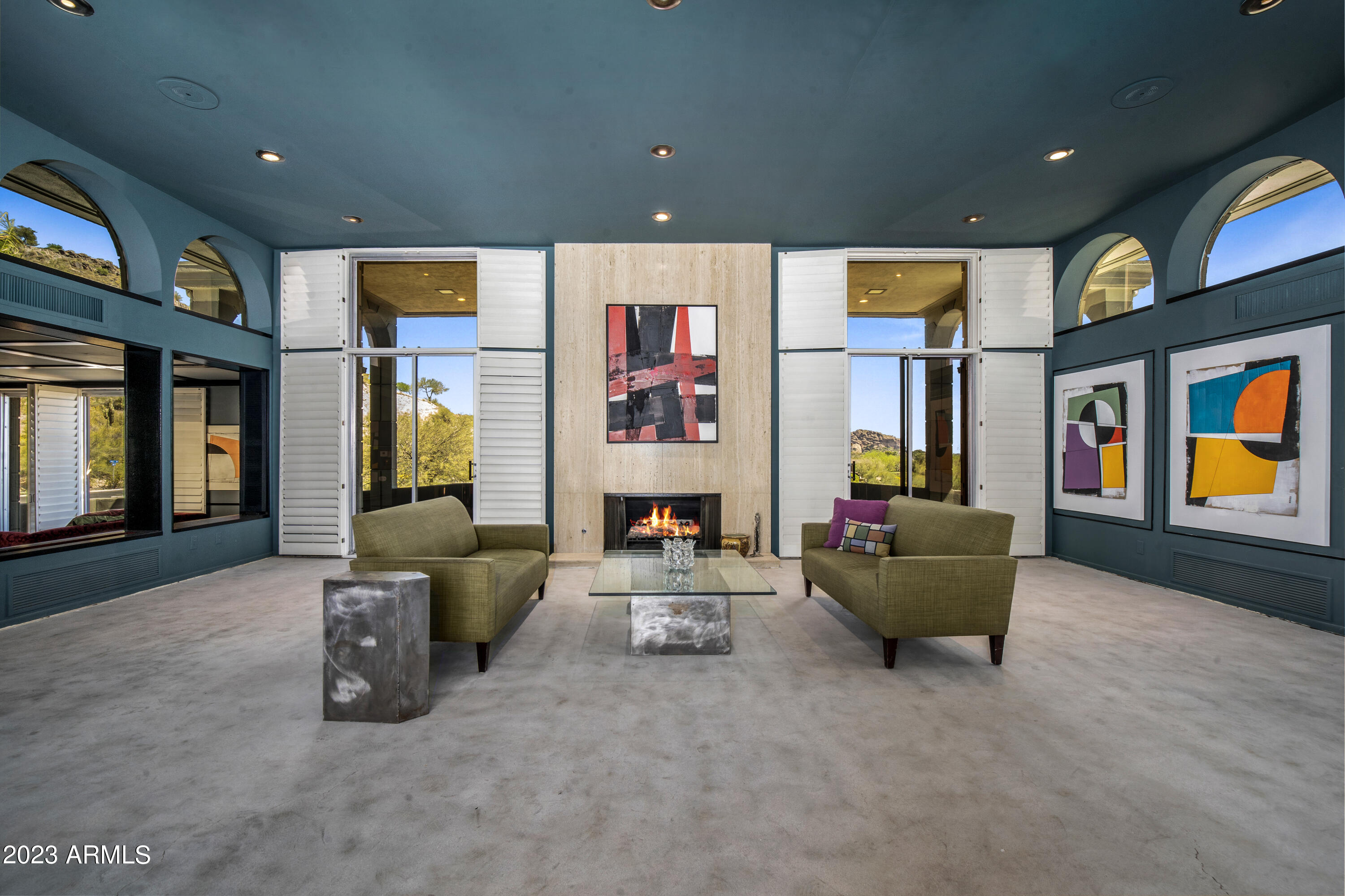 Paradise Valley home is a diamond in the rough, waiting for the right buyer to bring out its full potential. A rich history & iconic architecture, it exudes glamour and character.  Featuring stunning art deco elements, as well as Palladian, Hollywood Regency, and Neoclassical styles, this mid-century modern gem is truly one-of-a-kind. Situated on an oversized 2+ acre lot, it boasts spectacular views of Camelback, the city lights, and Phx Mtn Preserve. While some updates have been made (new roof, A/C's, kitchen, and water filtration system) there is still work to be done. It is just waiting for a discerning buyer who can see its potential and transform it into a mid-century modern masterpiece. With your tender loving care, you can make this your own glamorous paradise and uncover the the mystery of its origins.  While it cannot be confirmed, there are indications that it was likely designed by the renowned James McNaughton, who also worked on projects for the Goldwater family and other prominent figures in the 1960s.  The adjacent parcel #169-51-003 is also included in the sale.