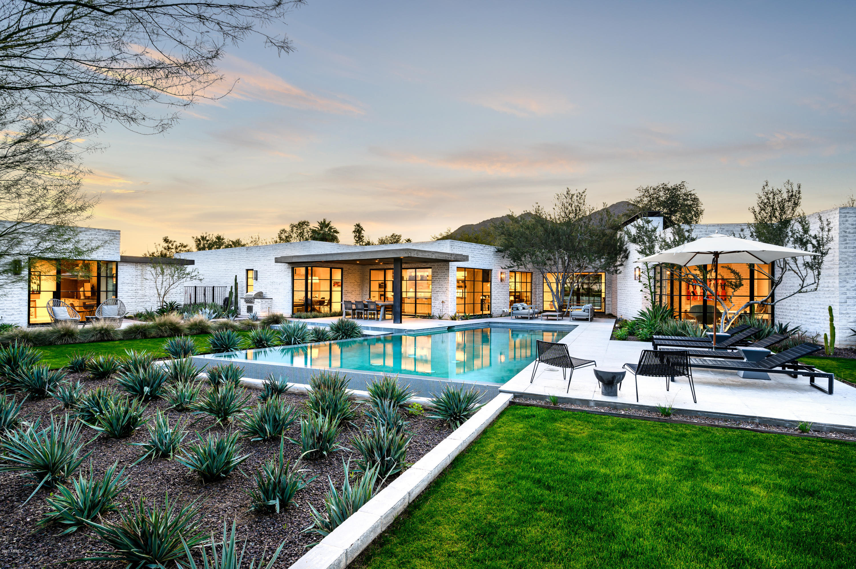 This warm mid-century modern retreat was built in 2016, located in the guard gated exclusive community of Casa Blanca Estates.  It is positioned on a premium, private, interior cul-de-sac lot.  The entertaining areas flow effortlessly between the interior spaces and exterior patios.  In addition, Nance Construction, Biegner-Murff architects, David Michael Miller interior design, Berghoff landscaping all come together to make this custom home of unsurpassed quality and rarely offered luxury property.