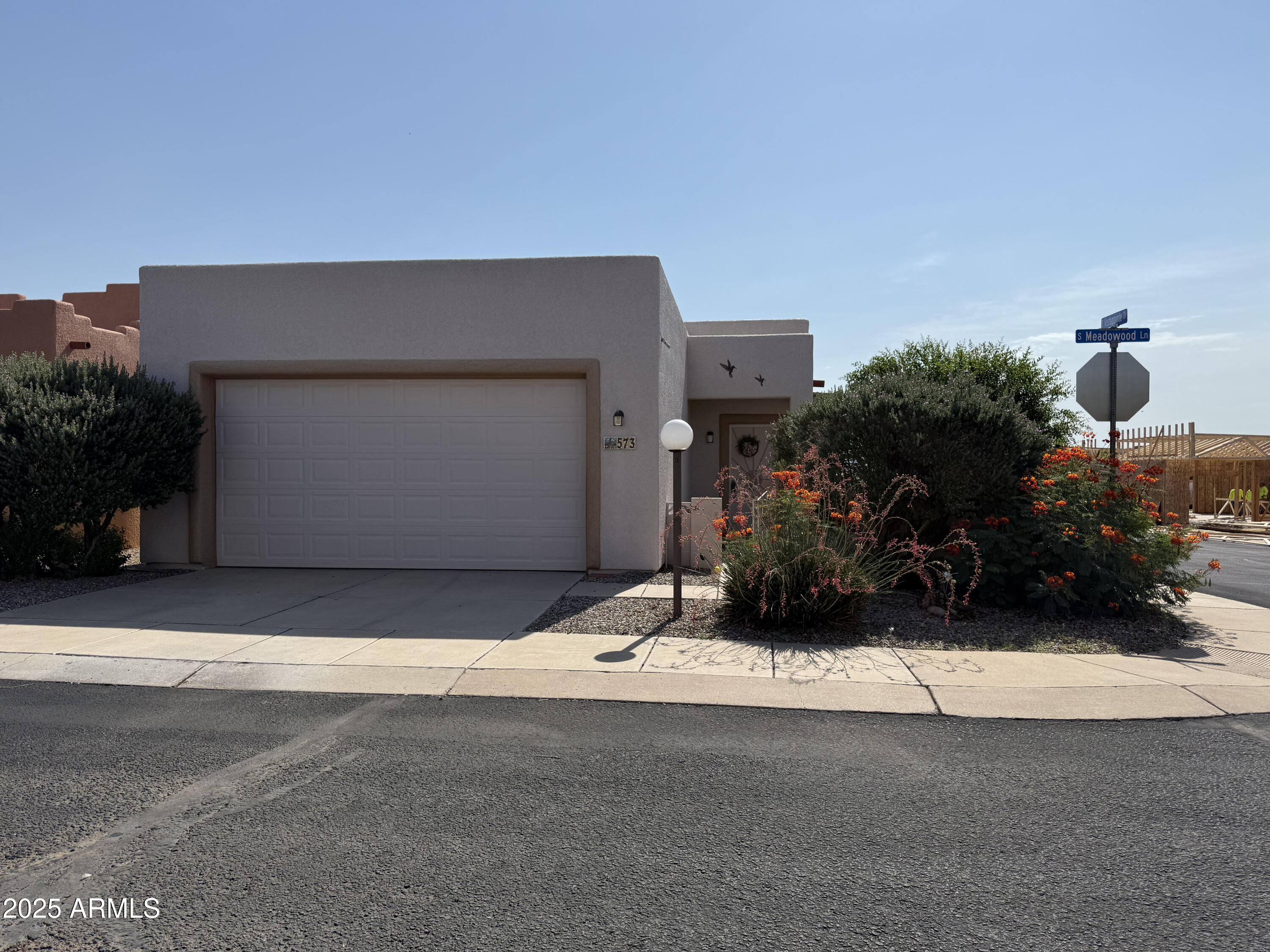 This home is so cute and it is ready for you owners. This is a very popular floor plan and is sits on a corner lot so only one real neighbor. the bedrooms are good sized and the master has a door to your backyard area. The master bath has a large shower and there is a tub in the main bath.  All of the floors are hard surfaces making this home very easy care. This 55 and over community has so much to offer! There are many activities if you would like to participate as well and a community pool, spa, shuffleboard, tennis court, gym and more. There is also gated security. This is not a home to miss!