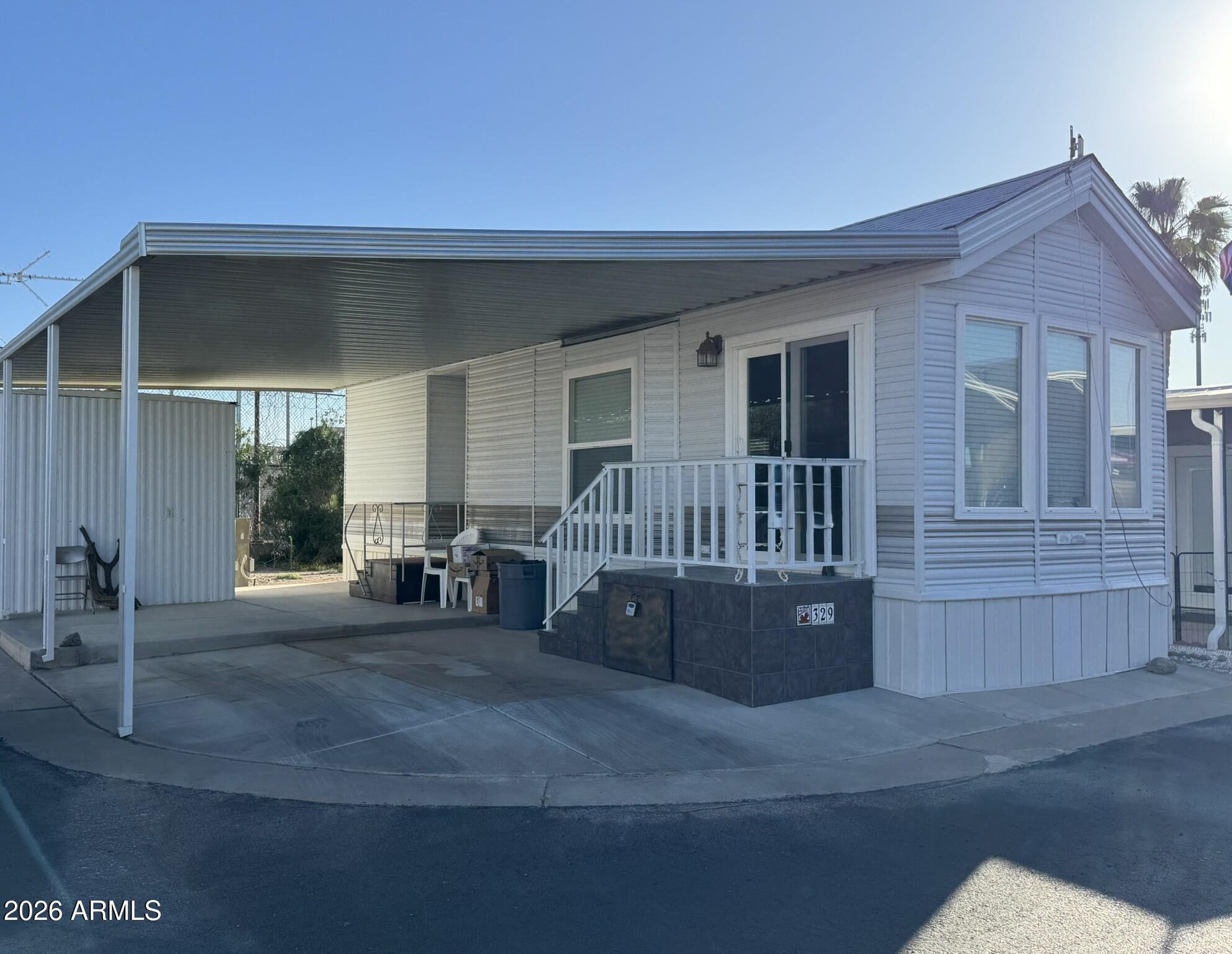 This well maintained 2000 Cavco park model offers 372 sq ft, comes fully furnished, and sits at the end of the street with no immediate neighbor to the east for added privacy. Interior features include newer laminate Pergo flooring, vinyl double pane windows, and a walk-in shower. The kitchen includes a refrigerator, electric stove, and built-in microwave, and the efficient layout maximizes space. Outside you will find a covered carport, storage shed, and step-out stair platforms at both front and back doors. The home also features a pitched roof with composition shingles. Located inside the 55+ Caliente Casa De Sol community with resort-style amenities. Caliente Casa De Sol is a desirable 55+ active adult resort community in Florence, Arizona, offering a welcoming environment for seasonal residents and year-round homeowners. The community combines beautiful desert surroundings with a strong social atmosphere and resort-style amenities designed for active living.

Residents enjoy access to a public 9-hole golf course, heated swimming pools and spas, and popular pickleball courts that host both casual play and organized events. The community clubhouse and recreation center serve as gathering spaces for social activities, meetings, and community events throughout the year.

Additional amenities include a fitness center, billiards room, and craft and hobby spaces for creative pursuits and group activities. The community regularly hosts seasonal events, entertainment, dances, classes, and organized social clubs, creating many opportunities for residents to connect and stay engaged.

Well maintained grounds, walking areas, and shared spaces make it easy to enjoy the Arizona sunshine and meet neighbors. With its wide range of recreational and social opportunities, Caliente Casa De Sol offers an active lifestyle community designed specifically for adults 55 and better.