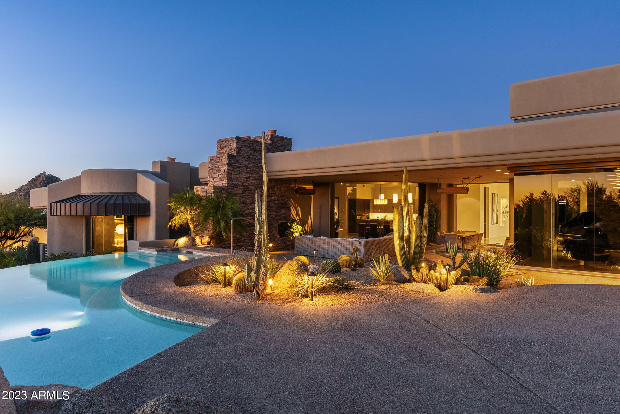 WELCOME TO THE CROWN OF TROON MOUNTAIN. PERCHED HIGH ON THE CORNER THIS PRIVATE MOUNTAIN MASTERPIECE HAS VIEWS FROM EVERY ROOM. MASTERFULLY REMODELED FEATURING  A GOURMET KITCHEN, GREAT ROOM OPEN TO DINING AND ENTERTAINING. 1000 BOTTLE WINE ROOM 3 BEDROOMS PLUS AN OFFICE 4 BATHROOMS  AND A PRIVATE CASITA WITH ITS OWN BATH AND SITTING ROOM PLUS  AN OVERSIZED AIR CONDITIONED 3 CAR GARAGE. THIS HOME IS AN ENTERTAINERS DREAM AND OFFERS THE BEST VIEWS TROON HAS TO OFFER, MOUNTAINS BY DAY AND THE VERY BEST SUNSETS AND CITY LIGHTS BY NIGHT. BOOK YOUR PRIVATE TOUR TODAY. ALL FURNITURE IS OFFERED ON A SEPARATE BILL OF SALE.