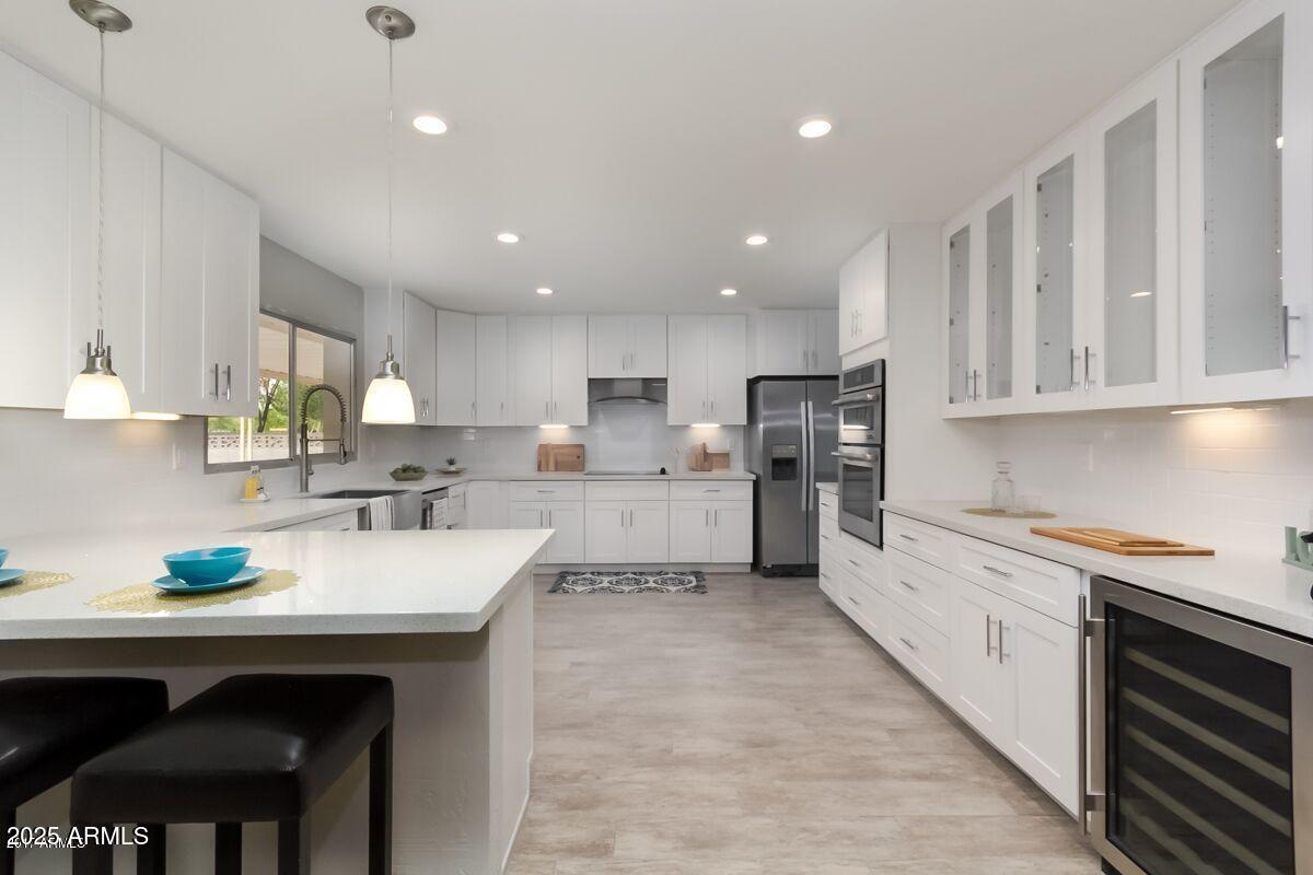 Beautifully Remodeled Home in Prime Location!
Step into this stunning, fully renovated residence showcasing exceptional upgrades throughout. The heart of the home is a modern chef's kitchen, complete with crisp white shaker cabinets, sleek stainless steel appliances, and luxurious quartz countertops--perfectly designed for both everyday living and entertaining.
Enjoy the warmth and elegance of ceramic wood-look tile flooring, complemented by plush carpeting in the bedrooms and Arizona rooms. Recent enhancements include brand-new A/C units, energy-efficient windows, and fresh interior paint, offering peace of mind and move-in readiness.
Ideally located just minutes from ASU, and a short drive to downtown Phoenix, Scottsdale, Chandler, and Gilbert--this home blends comfort, and style.