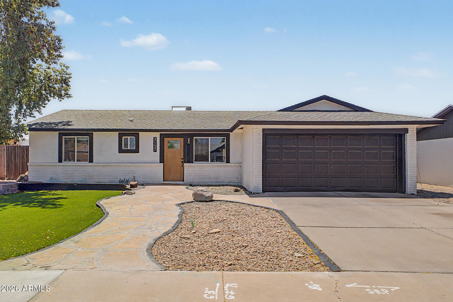 No HOA Mesa home with RV gate, parking slab, and a full 2024 renovation--offering modern updates and the flexibility buyers are looking for. This three bedroom, two bathroom home has been extensively remodeled with new windows and doors, fresh interior and exterior paint, luxury vinyl plank flooring throughout (no carpet!), updated electrical and plumbing, and added insulation for improved energy efficiency and year-round comfort. The open-concept layout centers around a completely redesigned kitchen featuring ceiling-height cabinetry, updated countertops, stainless appliances, and a large island that anchors the space for everyday living and entertaining. A new sliding glass door connects the main living area to the backyard, creating easy indoor-outdoor flow. Both bathrooms have been fully update with modern showers, vanities, and finishes. The laundry has been relocated inside for added convenience. Outside, the low-maintenance yard features turf and pavers, while the RV gate and dedicated parking slab provide space for trailers, boats, or additional vehicles--without HOA restrictions. Major systems have been addressed, including an updated AC (approx. 5 years old), offering additional peace of mind. With no HOA, extensive renovations, and RV parking, this move-in ready Mesa home stands out for both functionality and value.