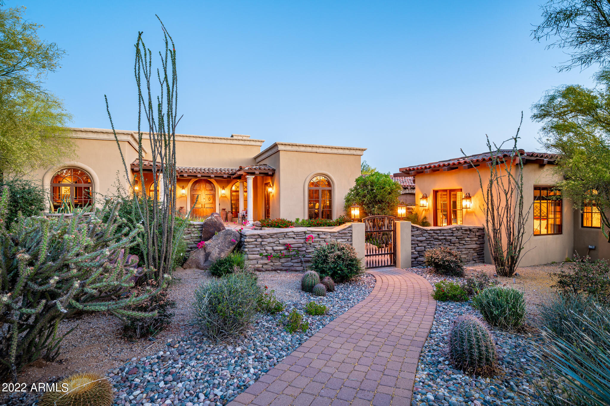 Updated custom home in the Country Club of DC Ranch!  This single level home is situated on over 1 acre and is tucked in a private cul-de-sac setting.  With south-facing orientation, abundant natural light is captured throughout the home.  Functional home design features a charming gourmet kitchen, three en suite bedrooms with large bonus room, private office, living room and dining room with stone barrel wall/ceiling opening to front courtyard.  Enjoy the spacious master suite with sitting area, connecting to an outdoor courtyard with a spa-like master bathroom opening to a private outdoor shower. The detached guest house features two bedrooms, breakfast bar, full exercise room and steam shower.  Tranquil outdoor spaces, both in the quaint front courtyard and private backyard which boasts a large pool, expansive covered patio space, BBQ center, turf and inspiring McDowell Mountain views.  Pride of ownership evident in all areas of this home with recent renovations and updates: new travertine and hardwood flooring, updated quartzite and quartz counter tops, updated master bathroom, neutral interior paint and gourmet appliances.  This property includes a 4 -car garage with ample storage and temperature control in the single stall.  Located just minutes from the DC Ranch gate, easy access to the Clubhouse, Market Street dining/shops, and the Loop 101 freeway. Plus miles of biking and walking paths throughout the community.  Truly one of Arizona's top addresses!