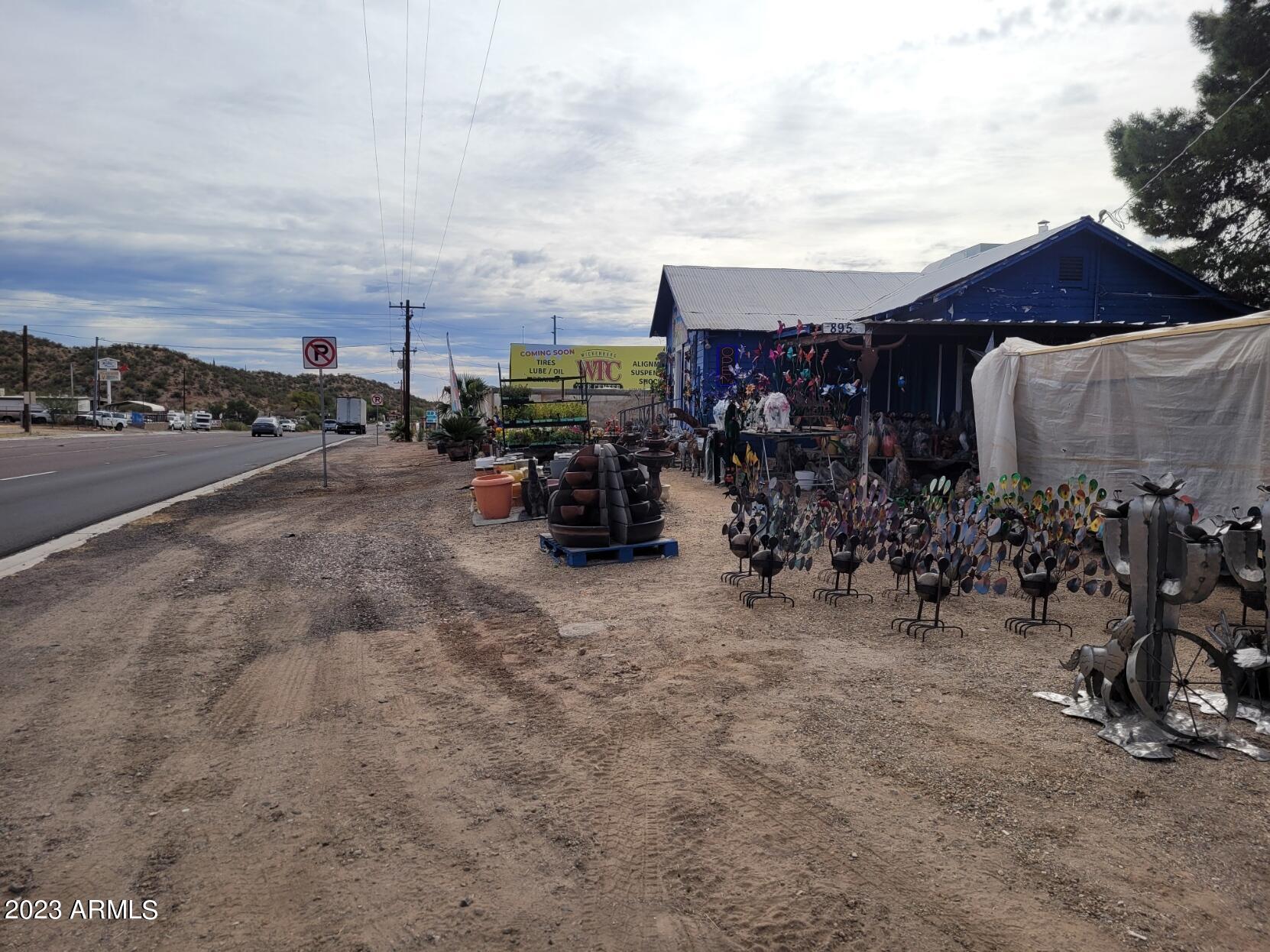Great visibility from this busy highway frontage east of downtown Wickenburg. Property use options: Commercial, Retail, Restaurant, Office, Nursery, more. Currently a landscape nursery. Do not disturb tenants. Billboard and billboard income included in the sale of the property.