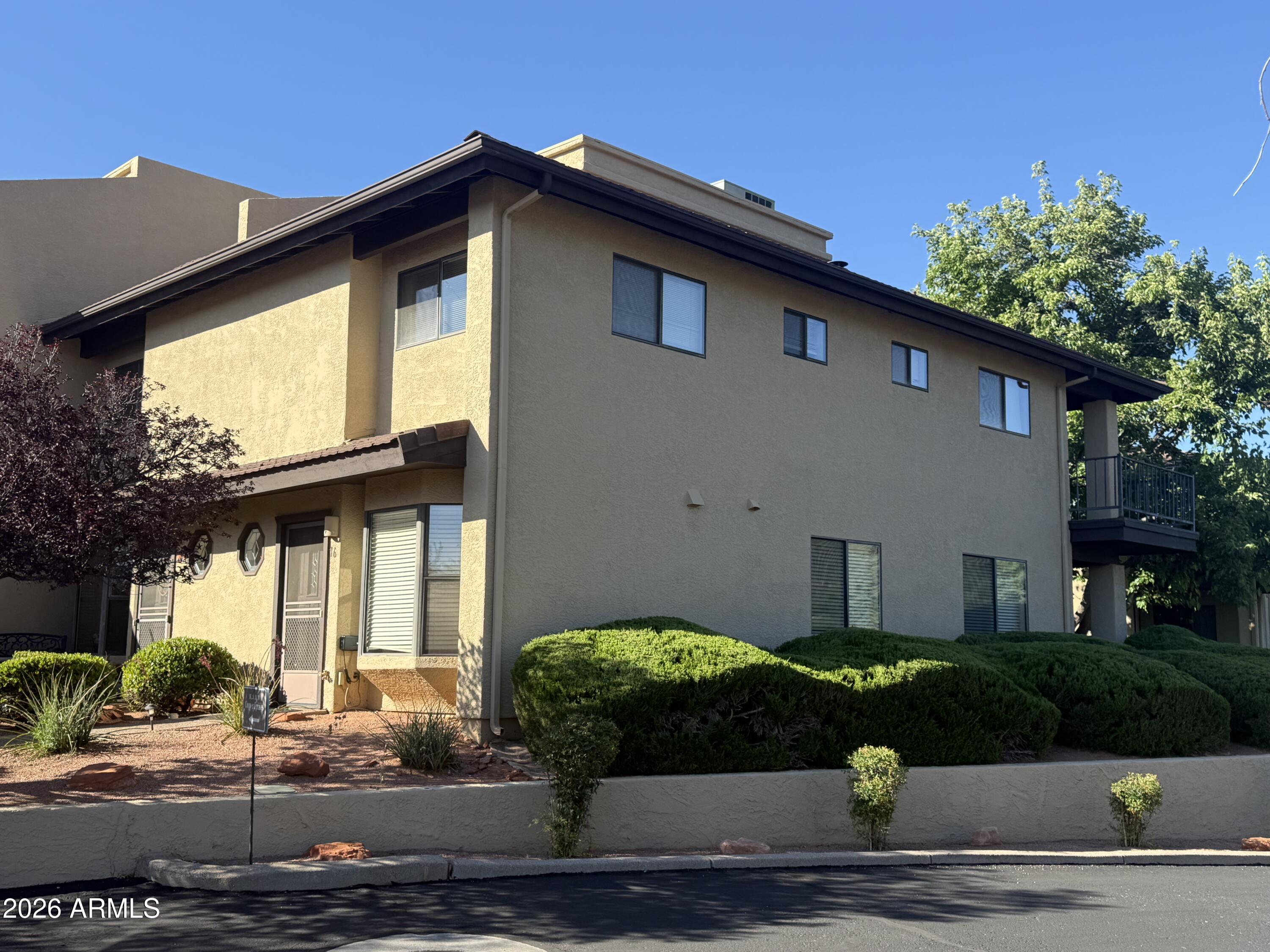 Investor Alert! High-performing, successful turnkey Airbnb property located in the highly desirable, gated golf community of Canyon Mesa Country Club. This premium corner-unit townhouse seamlessly blends profitable short-term rental history with warm, cozy Southwest charm. The main level features a spacious open-concept kitchen boasting granite countertops, perfect for entertaining guests, alongside a cozy wood-burning fireplace. Upstairs, you'll find two well-appointed bedrooms and 2 bathrooms. The primary suite serves as a private retreat, complete with a private balcony offering stunning, mesa views. Fully furnished and ready to generate income from day one. Properties with this level of established rental success and premium corner positioning rarely last long! Come and see it now. Key Features
Space & Layout: 2 Bedrooms, 3 Bathrooms, 1,280 Sq. Ft. of beautifully designed interior living space.

Premium Positioning: Desirable end/corner unit boasting natural light, and scenic views of local mountains and lush trees.

Southwest Charm: Featuring a cozy wood-burning fireplace in the living room and an open-concept flow perfect for guest entertainment.

Chef's Kitchen: Spacious kitchen complete with elegant granite countertops.

Located within a premier gated enclave, residents and guests enjoy resort-style living with access to:
-Executive 9-Hole Golf Course
-Clubhouse, Heated Pool, and Spa
-Tennis & Pickleball Courts
-HOA Benefits: $676/month covers comprehensive exterior maintenance, roof repair/replacement, street maintenance, trash, pest control, and front yard care, sewer and unlimited golfing.

Investor Highlights:
- turnkey Ready: Sold fully furnished--start booking guests or move right in from day one.
- Proven Performance: High-performing short-term rental history in  a region with high year-round tourism demand.
- Convenience: Features an upper-level laundry setup (washer/dryer included), a detached carport space, and low-maintenance desert landscaping with automated watering system.