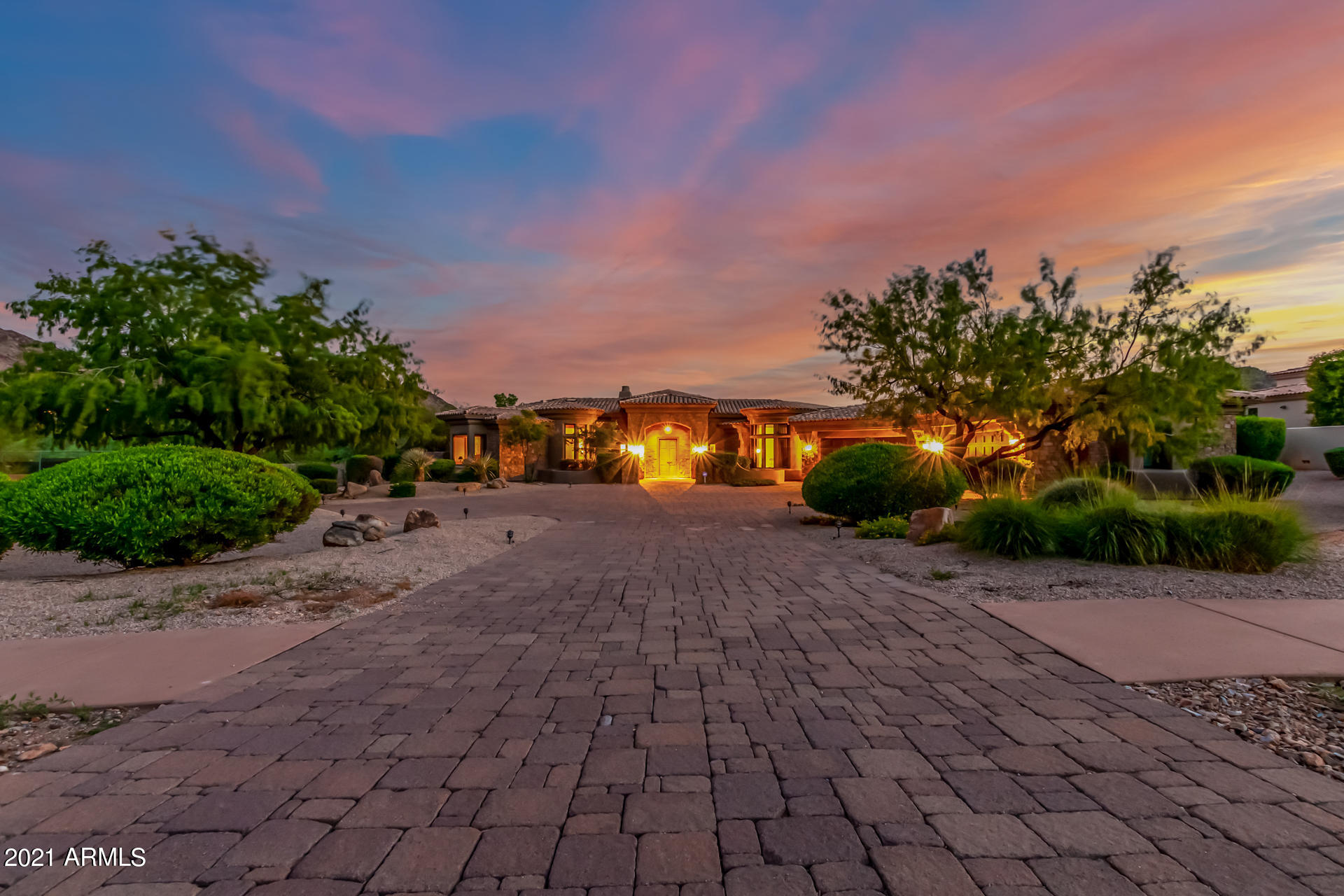 Outstanding Estate with amazing curb appeal, paver circular driveway,  5 beds, 6.5 baths! Dramatic high ceilings, stone floors, decorative columns, upgraded lighting, & a soothing palette. Fantastic living room with an inviting classic fireplace and gold leaf cathedral ceiling. Breathtaking views from every window! Formal dining room and spacious family room with a a stunning wood ceiling. Exquisite gourmet kitchen features staggered distressed cabinets with crown molding, high-end appliances, stone and wood counters, an island with breakfast bar, walk-in pantry, and breakfast nook. Each room is a work of art! Bedroom with wet bar & a private den. Generous size bedrooms, large closets, & upscale baths. a fireplace, and luxurious ensuite with stylish double sinks, free standing tub. Large laundry room w/storage cabinets & sink. An entertainer's dream backyard with an exterior fireplace, covered patio w/designer touches, built-in BBQ, putting green, sparking pool, spa, on a view lot! Don't miss this once-in-a-lifetime opportunity! Call now!