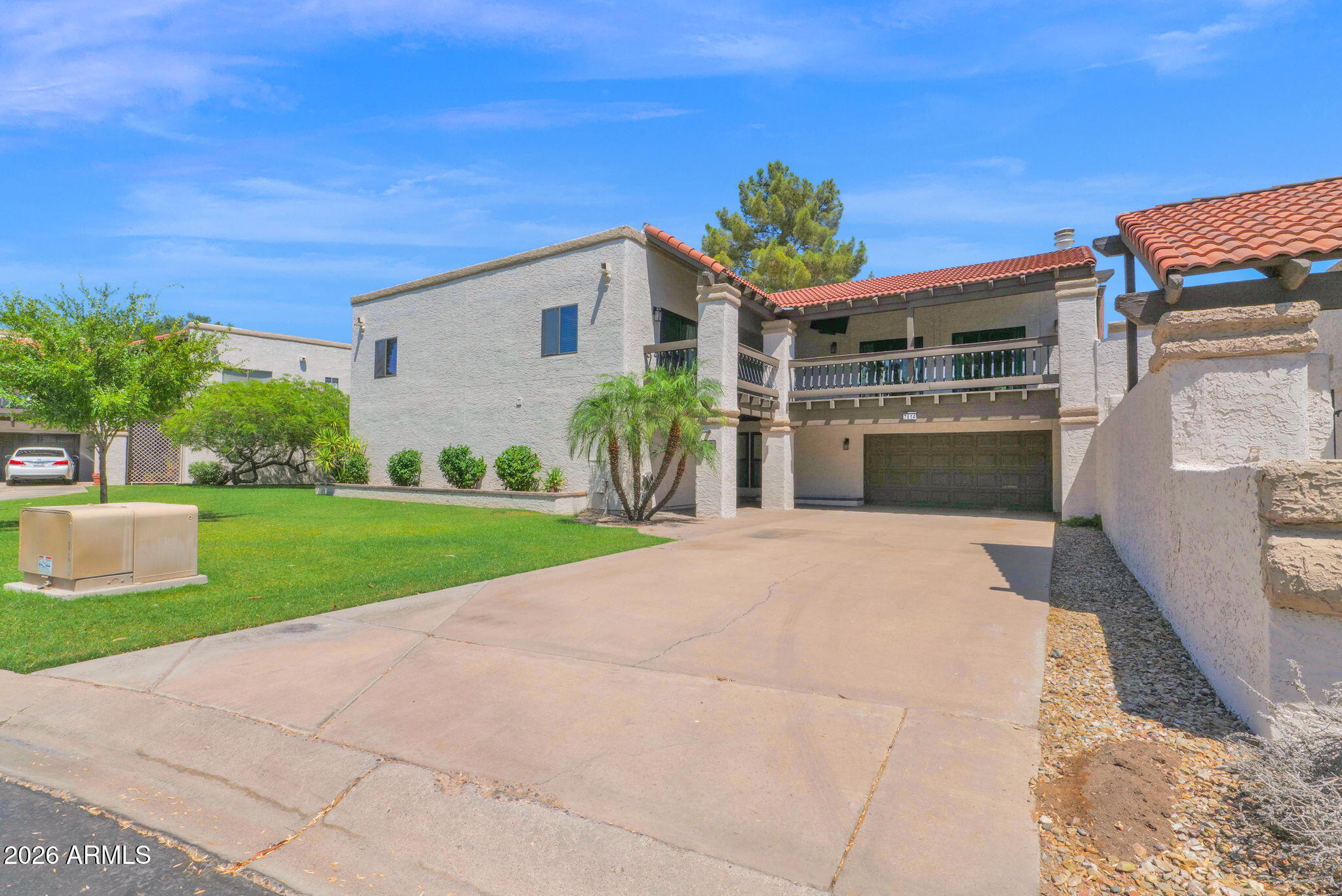 Step into a house that feels like home. Nestled in the heart of McCormick Ranch, this beautifully refreshed residence lives like a single-family home, sharing only one garage wall. With 5 oversized bedrooms, 3.5 bathrooms, and a desirable first-floor primary suite, the flexible floor plan offers space for everyone. Multiple fireplaces create warmth and character throughout, while the expansive bonus/game room with wet bar offers endless possibilities for entertaining, hobbies, work, or play. The spacious kitchen features alder cabinetry, granite countertops, stainless steel appliances, abundant storage, and a large breakfast area that opens seamlessly to the living and dining spaces. New carpet and fresh paint complete this move-in-ready home. Each oversized bedroom enjoys its own private balcony. Sliding doors and plentiful windows fill the home with natural light and create an airy feel throughout. The oversized garage offers exceptional storage, and the lot provides ample private parking. Several TVs and the bonus room refrigerator convey. Take advantage of the summer market and make this McCormick Ranch home yours before seasonal buyers return to Scottsdale.