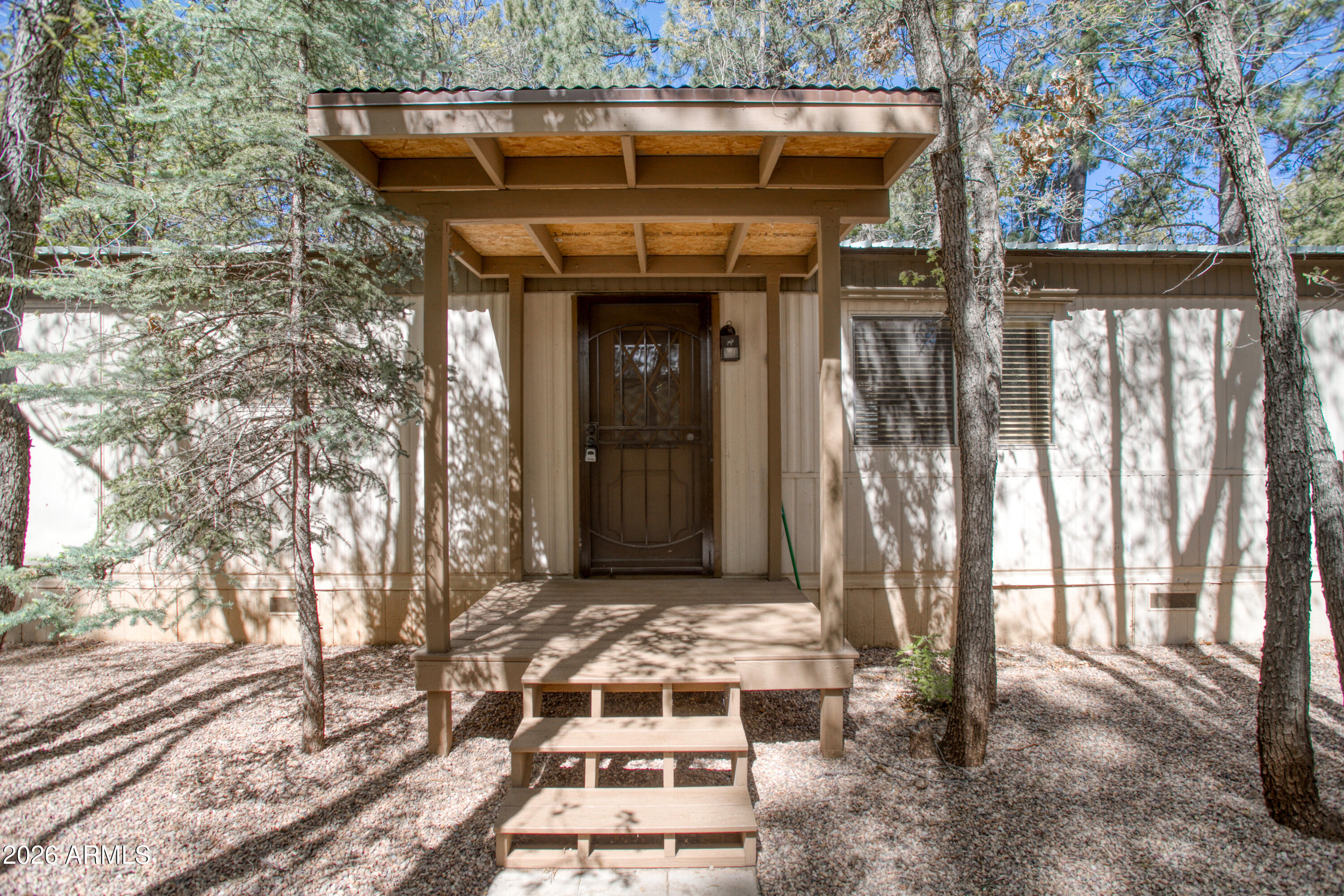 Nestled among the tall pines, this charming and affordable 2 bed, 2 bath home offers comfort, mountain serenity and peace of mind updates. Recent improvements include updated plumbing, electrical, and insulation, along with new flooring throughout, giving the home a refreshed feel while maintaining its cozy character. New covered carport for convenient parking, all set in a peaceful, tree-filled setting. Ideal as a weekend escape, rental opportunity, or full-time mountain retreat with great potential in a beautiful location.