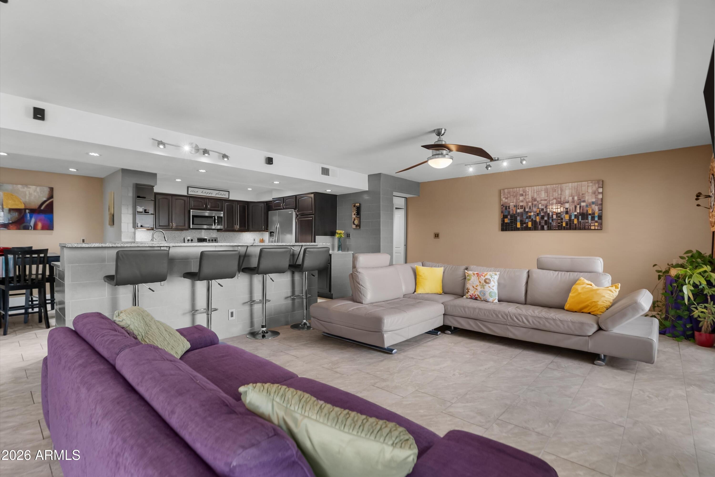 RARE OPPORTUNITY: ONE OF A KIND-LARGE CORNER PENTHOUSE (DOUBLE) Unit w/ Million Dollar Views of 3 mountains -Pride of Ownership. Nestled within walking distance of Old Town Scottsdale, Fashion Square, walking parks, and dog parks. Experience this impeccably updated corner penthouse unit that combines spacious living with an abundance of rare on-site amenities. This beautiful retreat includes three (3) bedrooms, three (3) baths, office & 2130 square feet of elevated living with many quality and unique upgrades. Enjoy Large Great room with  Fireplace. Chefs Gourmet Kitchen has High End Stainless appliances, custom cabinets, Granite Counters, & Breakfast bar. MUST SEE..WILL NOT LAST LONG!
