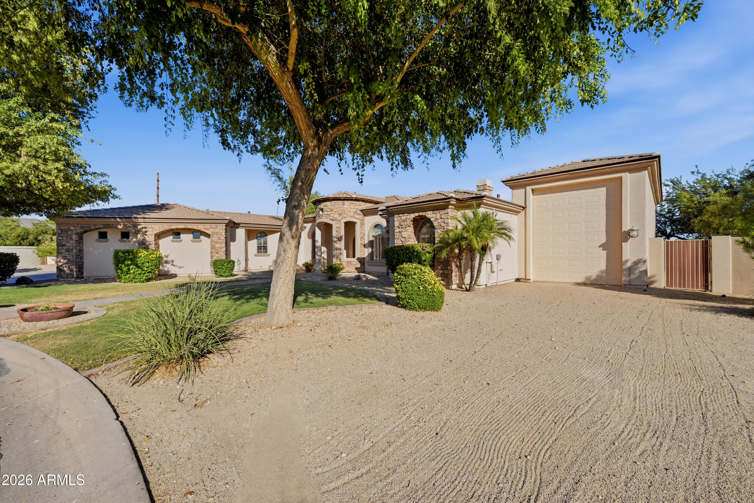 Prestigious gated Montana Dorada at a price that's hard to beat. Premium corner cul-de-sac lot surrounded by multimillion dollar estates with quick 202 access. This 5 bed, 3.5 bath has the big-ticket items already done: NEW ROOF, NEW A/C, fresh paint throughout, and a refreshed kitchen with new granite counters, tile backsplash, island, and breakfast bar. Formal dining, cozy den, media room, and plantation shutters. Primary suite with private exit to the pool and expansive backyard. Heated and cooled Pebble Tec diving pool, covered patio, built-in BBQ, and room to grow. 3 car garage PLUS a huge RV garage AND an RV gate. Bring the boat, the trailer, and the work rig. There's storage for it all. Homes like this here don't last.