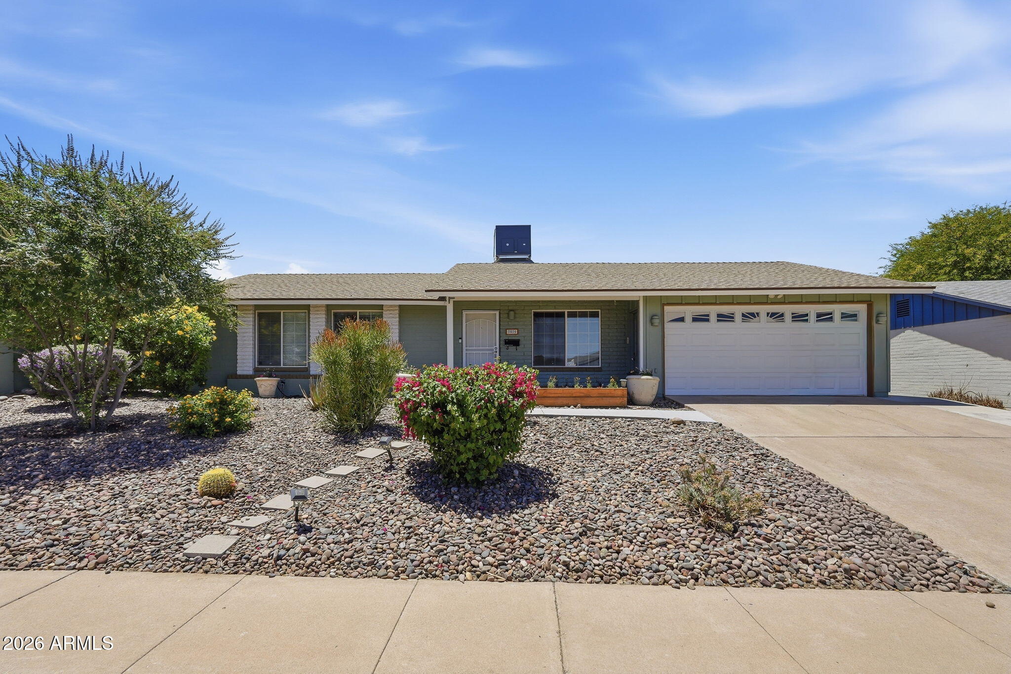No HOA! Experience the perfect blend of comfort & style in this stunning three-bedroom, two-bathroom single-story gem! Boasting new luxury vinyl plank flooring throughout & a new HVAC (2024), this home is move-in ready! Solid block construction meets modern updates! The updated kitchen shines with espresso cabinets, granite counters, stainless appliances (gas cooktop) and an RO water system. Retreat to the massive master suite, featuring updated closets and a remodeled spa-like bath with a whirlpool tub. Situated on a huge private lot near top-tier schools, the backyard is an entertainer's dream with a fully turfed yard, sparkling pool, & irrigation in front and back garden beds. Complete with a bright Arizona room, this clean, unoccupied home is priced to sell. Within mins of highways!