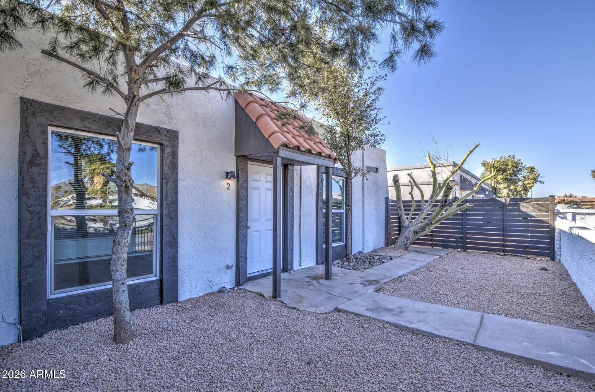 This nicely updated 2-bedroom, 1-bath unit in Apache Junction, AZ, offers 840 sq ft of living space. The entire unit has vinyl plank floors, 2 skylights, and vaulted ceilings. The kitchen features plenty of cabinet space and black appliances.  Enjoy a private fenced front yard  space.