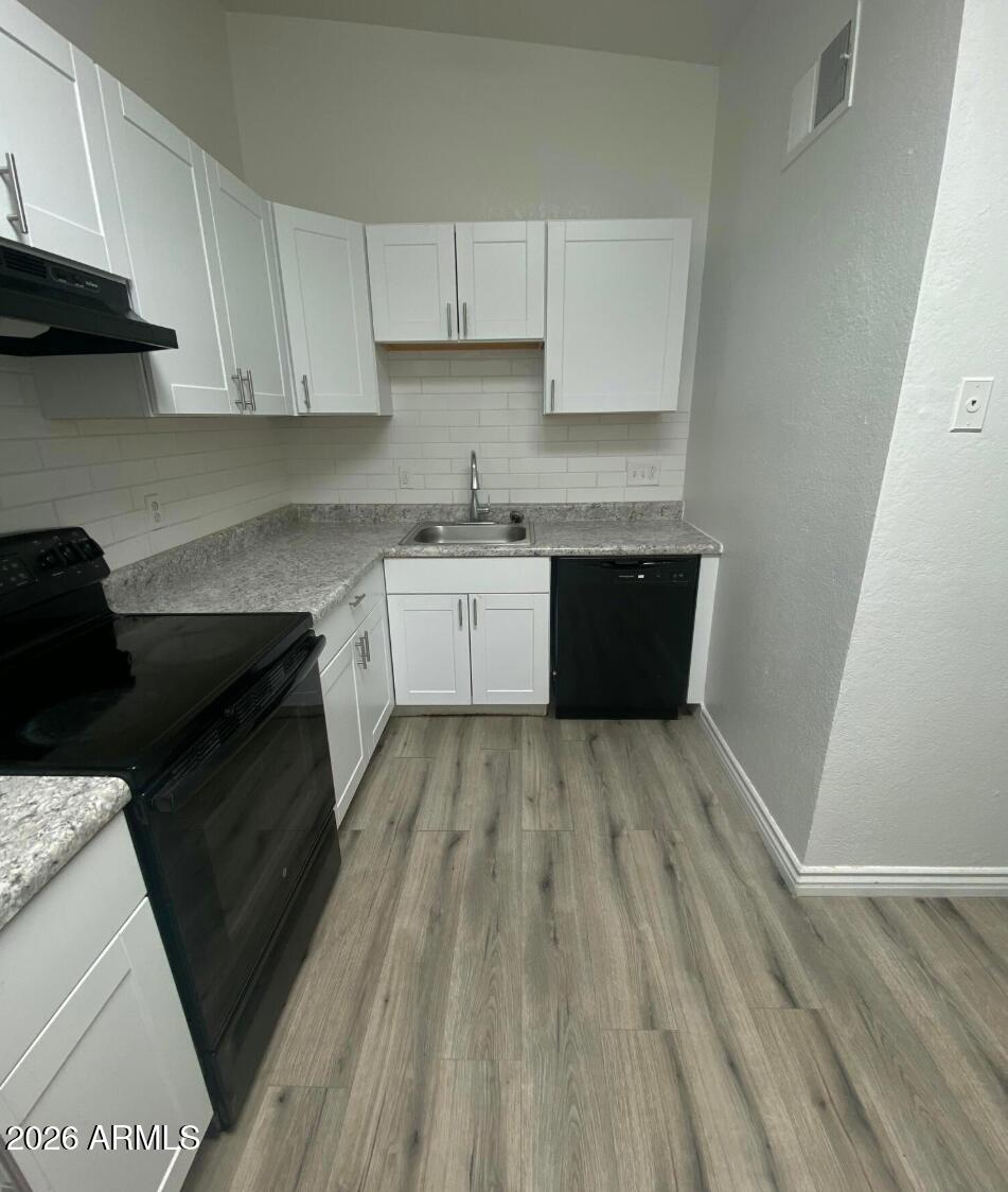 This nicely updated 2-bedroom, 1-bath unit in Apache Junction, AZ, offers 840 sq ft of living space. The entire unit has vinyl plank floors, 2 skylights, and vaulted ceilings. The kitchen features plenty of cabinet space and black appliances.  Enjoy a private fenced front yard  space.