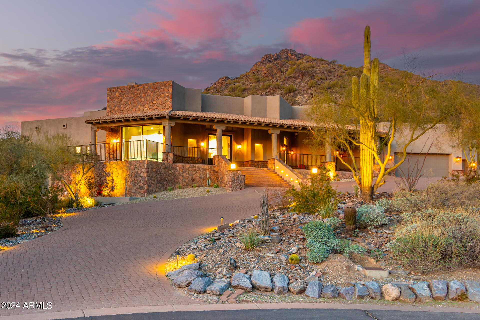 Stunning, meticulously, fully remodeled, upgraded home located in the exclusive, guard gated One Hundred Hills Community in a secluded cul-de-sac on an oversized lot, along the mountain preserve with magnificent, panoramic unobstructive mountain and city views. This exquisite contemporary/territorial sanctuary with custom features boasts soaring ceilings, strategically placed windows which flood the home with natural light and premium views throughout the home from every room.  Engineered oak wood flooring, knotty alder wood doors and custom kitchen cabinets, 5 gas fireplaces and a 2000 square foot 3 car garage with 220 watt electric. Home has been freshly painted inside and out. All new lighting, ceiling fans and hardware. Chefs' kitchen updated with quartzite counter tops, island with prep sink, Wolf gas cooktop w/dbl ovens, Sub-Zero refrigerator/freezer, overlooking the separate dining and living rooms, each with a fireplace. Office/music room with commercial slider glass wall door with views of Camelback Mountain and city lights. The primary bedroom is a spacious haven with a sitting area and gas fireplace, glass French doors leading to the back patio. Private master bathroom with soaking tub and luxurious custom features. Split floor plan with 3 other bedrooms and ensuite bathrooms. The tranquil backyard paradise features a water fountain, cozy, entertaining areas, outdoor fireplace, and grill which backs to the mountain preserve, and is one of the expansive patios around the home. This incredible turnkey ready home is located in the heart of Scottsdale near shopping, dining and entertainment while providing solitude in opulent surroundings. Home has been remodeled and professionally decorated. All furnishings are available on a separate bill of sale.