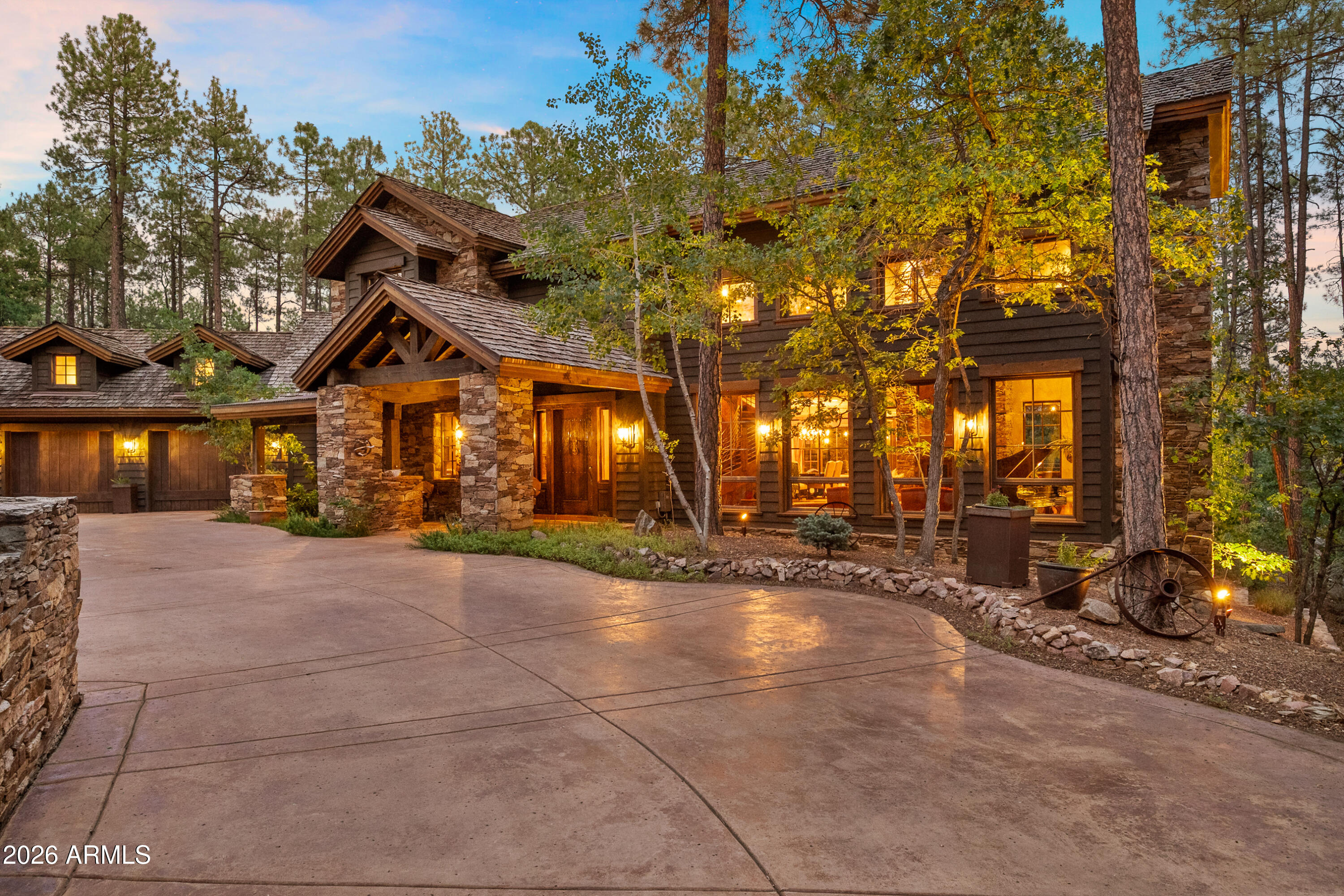 Originally homesteaded over 100 years ago, High Valley Ranch, with crystal mountain streams, lush alpine meadow, and stands of oak and ponderosa pine, is now an exclusive enclave of exquisitely custom 2-acre estate homes minutes from historical downtown Prescott. The design philosophy of using the finest organic elements and materials to seamlessly blend architecture with nature has been accomplished in this exceptional home. From windows reaching the sky to whiskey oak barrel floors, and true stone finishes, the understated grandeur is apparent in every detail. Massive wood beams, the finest masonry craftsmanship, artisan created metal work and wall finishes are highlighted throughout the main floor living interior in quiet mountain luxury. Whether a forever home, mountain getaway, or legacy property for generations to come, this High Valley Ranch estate offers the epitome of luxury mountain living and the convenience of city lifestyle.