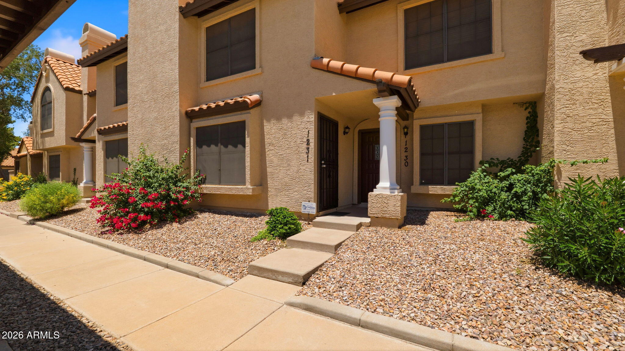 Location, location!! Welcome to the desirable community of Discovery at Continental Orchard! Close to Tempe Market Place and Cubs Spring Training. This inviting 2-bedroom ,1.5-bath townhome blends comfort, style, and convenience in a fantastic community setting. Inside, you'll find a spacious great room featuring neutral tile flooring and cozy fireplace. The updated kitchen is designed to impress with brand new stainless steel appliances, sleek new quartz countertops, upgraded cabinetry, and a convenient breakfast bar perfect for casual dining or entertaining.
Upstairs, both generously sized bedrooms feature plush new carpeting and soaring vaulted ceilings, creating a bright and relaxing retreat. Primary bathroom has been completely remodeled with a clean modern style. Also includes a new washer and dryer. Step outside to your private backyard oasis with an open patio--ideal for morning coffee, weekend BBQs, or simply unwinding outdoors. Enjoy easy access to the community pool and the added convenience of an assigned carport parking spot with plenty of guest parking. Unit has plenty of storage and closet space. This charming home offers the perfect blend of comfort and low-maintenance living--don't miss this opportunity!