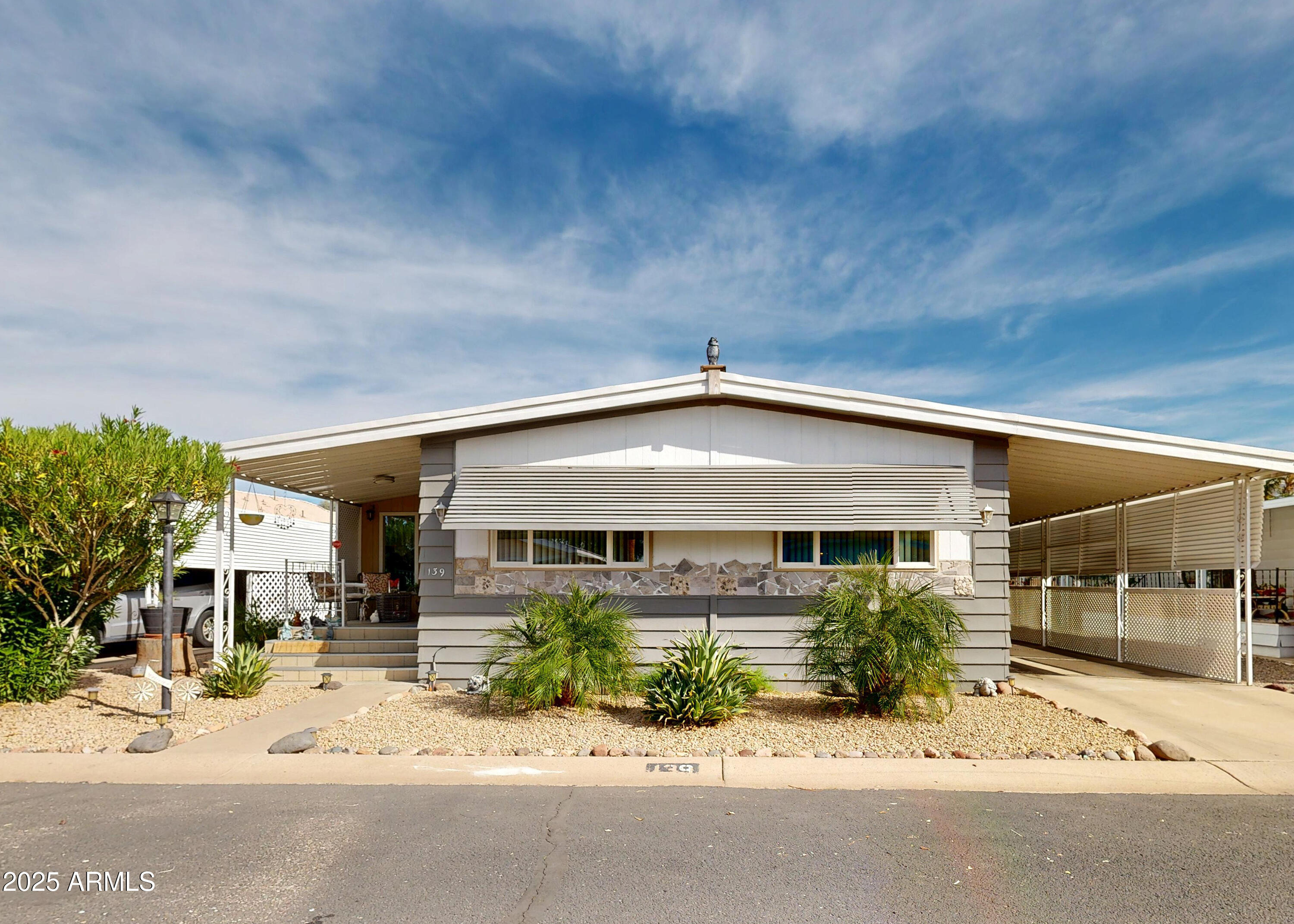 ON LEASED LAND:
Step inside this absolutely gorgeous 2 bed 2 bath home.  Updated with charm in all the right places. All new dual pane windows, roof updated, ac recently updated.  This is absolutely stunning home, it is a must see.   Most furnishings included.    Enclosed Arizona room for extra space, even a fully fenced backyard for privacy. 

Located in a gated 55 age restricted  resort style community.  Lots of activities including billiards, cards, gym, bocce ball, pitch and putt course, BBQ,  library, lounge with sports package tv.