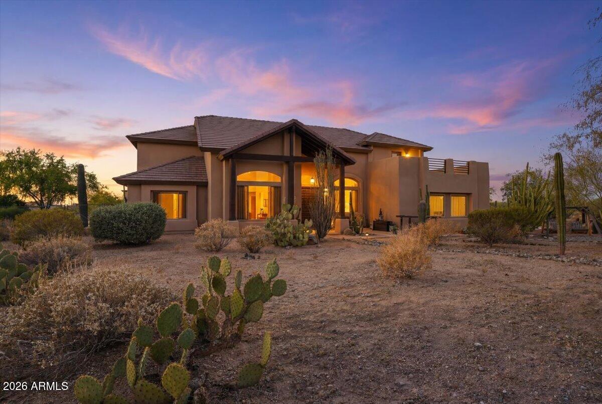 Rare opportunity to own a truly custom estate in the heart of East Mesa, where space, craftsmanship, and Arizona's natural beauty converge. Situated on over 2 acres with sweeping mountain views, this one of a kind property offers the privacy of rural living with every modern amenity. The main residence spans over 3,900 sq ft of thoughtfully designed living space, featuring 4 bed & 2.5 baths with the oversized primary suite conveniently located on the main floor. Step outside and the property truly sets itself apart. A massive 1,600 sq ft detached shop is ideal for equipment, hobbies or constructing. The expansive lot offers room to breathe, with dark desert skies that make the starry nights here truly spectacular.