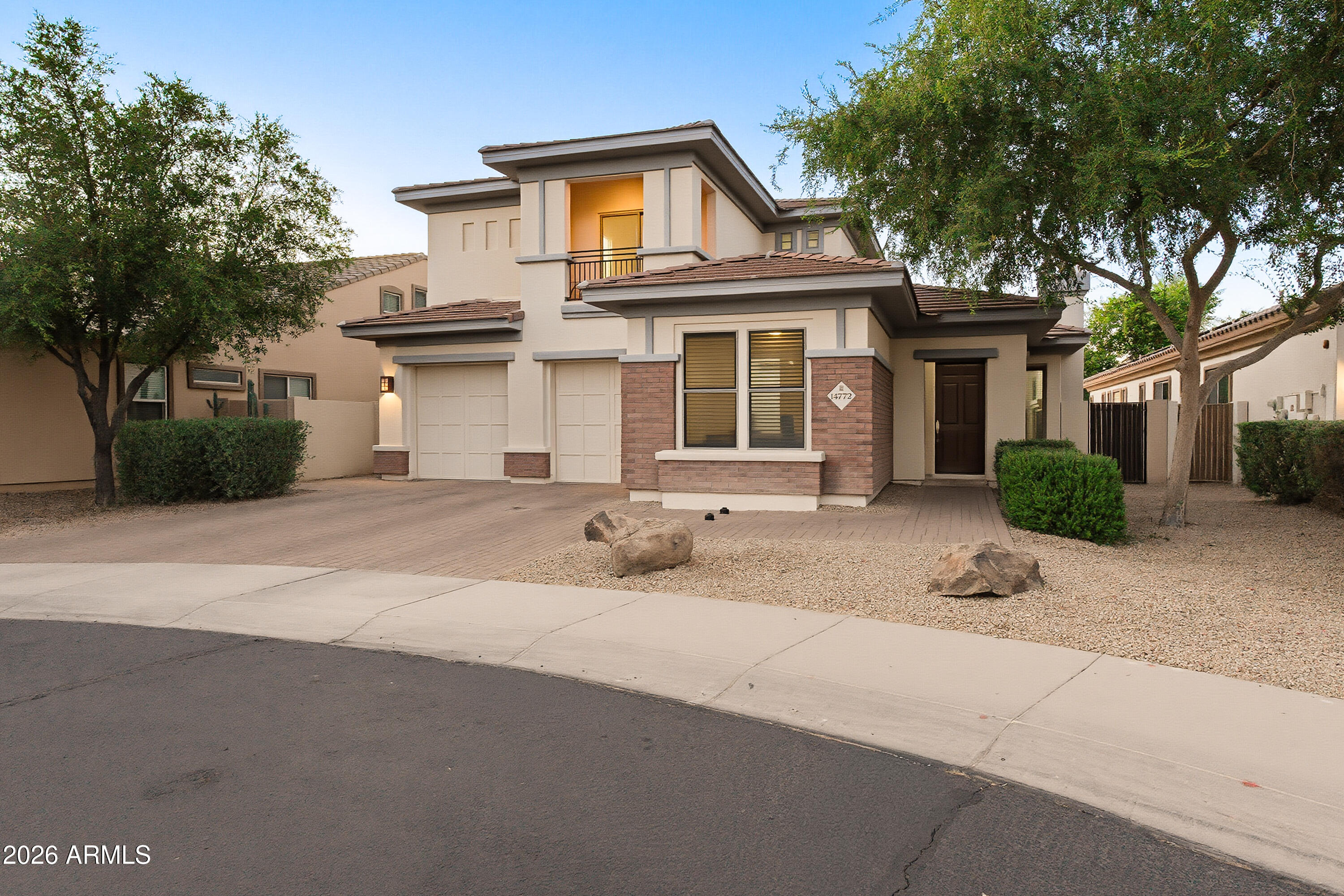 Experience refined luxury living in the prestigious Villages in Litchfield Park, one of the West Valley's most sought-after upscale communities. Situated on a premium cul-de-sac lot with no neighbors behind, this exquisite two-story estate offers approximately 3,800 square feet of beautifully updated living space designed for both elegance and comfort. Featuring 5 spacious bedrooms, 3.5 bathrooms, and an additional flex room easily convertible into a 6th bedroom, private office, fitness studio, or media room, this home offers exceptional versatility. Rich wood flooring and designer tile flow throughout the main level, complemented by fresh interior paint, updated baseboards, and sophisticated finishes throughout. The warm, inviting kitchen showcases rich brown cabinetry, stainless steel appliances, and generous entertaining space. The expansive backyard retreat features a sparkling pool, covered patio, and endless possibilities for luxury outdoor living. Ideally located within walking distance to parks, top-rated schools, shopping, and dining, this exceptional residence blends timeless elegance with everyday convenience.