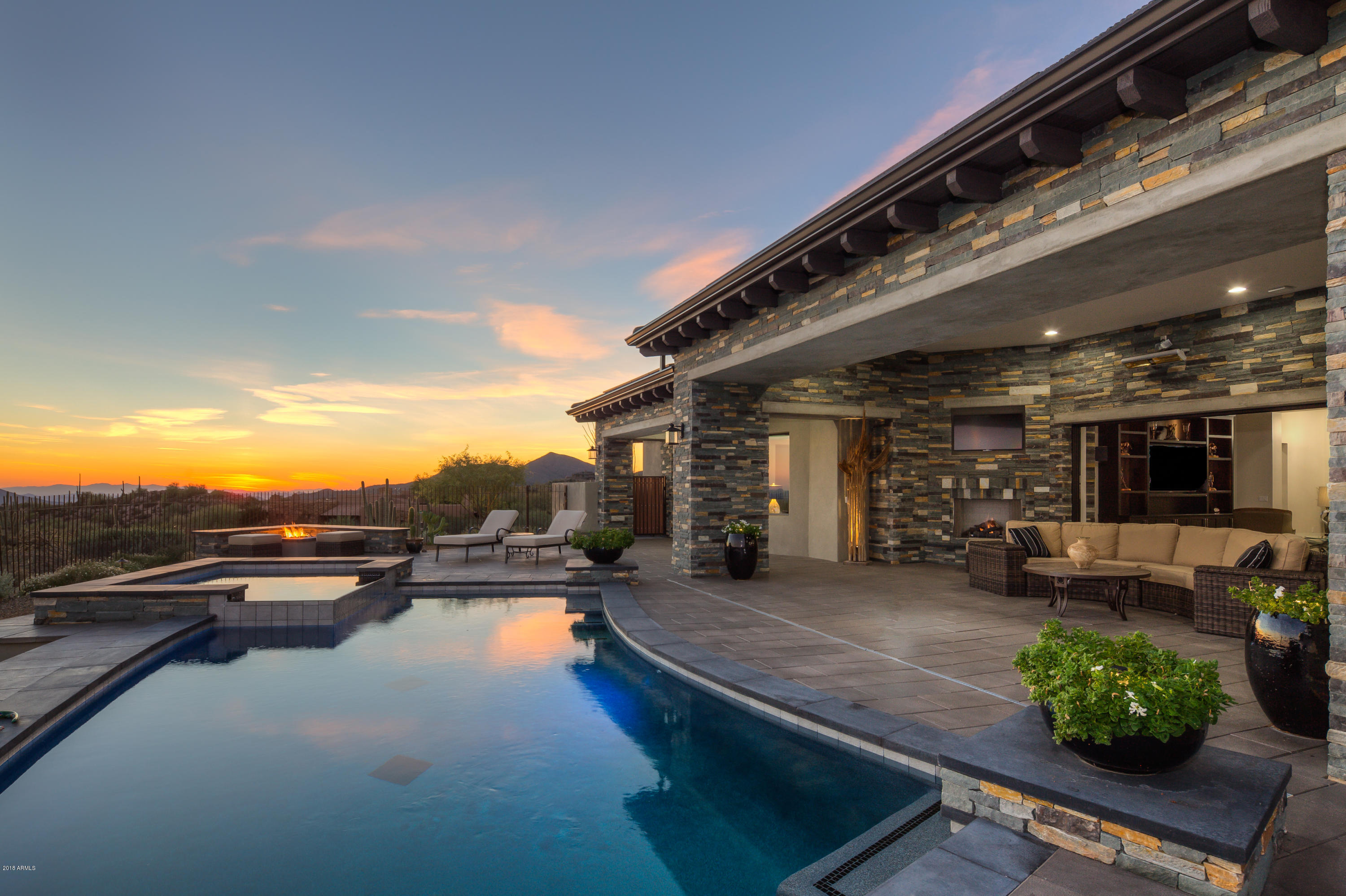 Contemporary overlooking Chiricahua's 7th fairway and stunning Valley views.  Iron works entry door open to a spacious, open plan showcasing all of today's finishes: ash wood floors, a variety of exquisite white granite counter-tops, alder cabinets & doors, and polished nickel fixtures. The Wolf/Sub Zero appliance pkg, LED light package, solar panel system, control 4 electronics and central vacuum, and mounted outdoor heaters incorporate today's technology.  Soft shades of neutral materials are used inside and out, creating an aesthetic continuity of design.  Special features include a generous chef's kitchen, entertaining wet bar, zen master suite with luxury bath & his/her closets, executive office (4th bedroom), air-conditioned workshop and oversized garage. Ultimate Desert Lifestyl