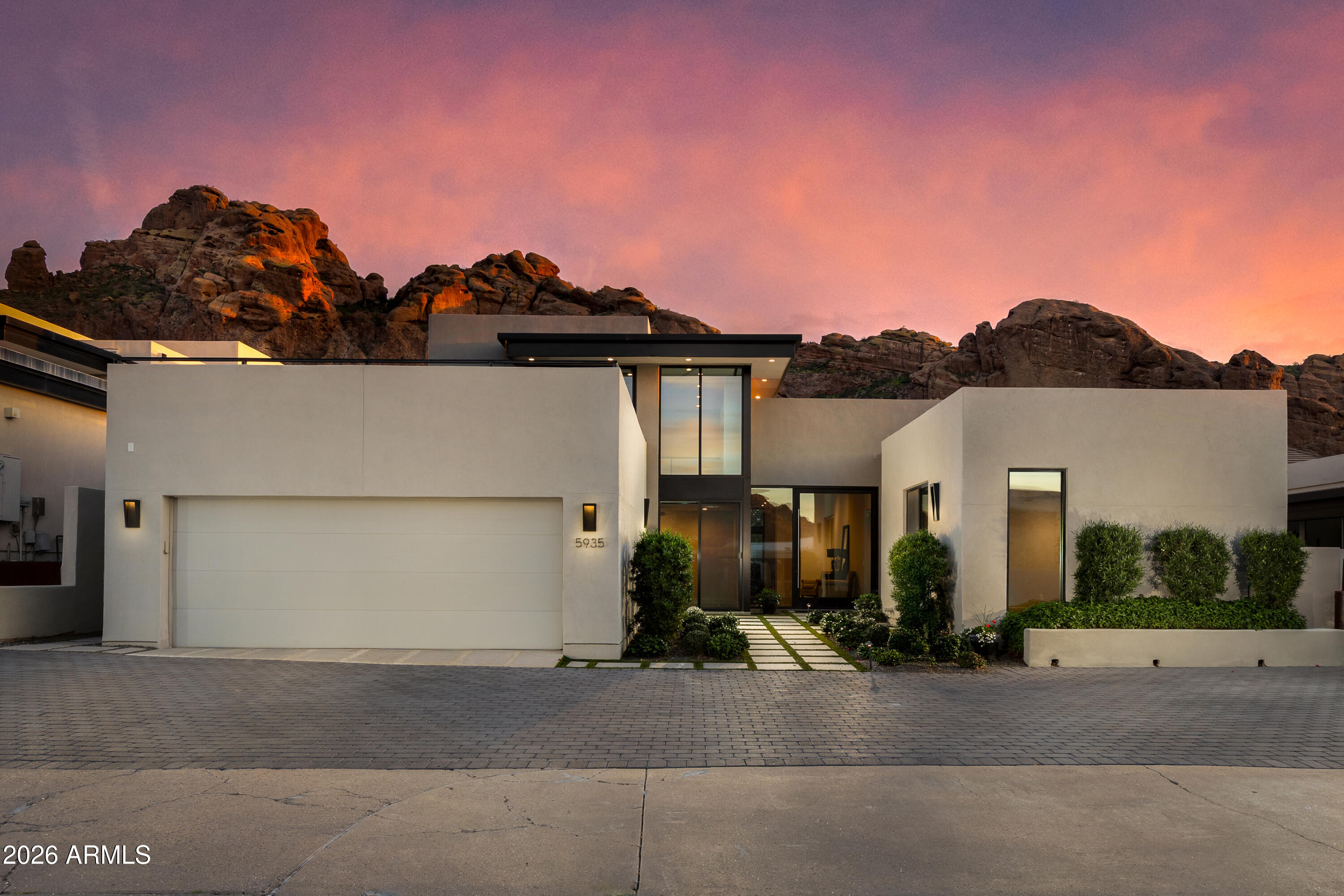 STUNNING CAMELBACK MOUNTAIN VIEWS! The perfect LOCK & LEAVE, in the highly coveted guard gated Echo Canyon community. This property lives completely on ONE LEVEL, with Primary down and copious amounts of NATURAL LIGHT. Upstairs is a generous LOFT STYLE en suite room with a HUGE view patio deck. Enjoy practically 360-degree Mountain and Town of Paradise Valley views. Floor to ceiling windows encapsulates the true majesty of Camelback Mountain. MODERN & practically NEW, this home has been very lightly lived in since its completion in 2019. Featuring Crestron smart home features, electric blinds, and a whole home sound system. All the storage space and amenities you need, with incredibly low maintenance well-manicured landscaping and TOTAL PRIVACY | WELCOME HOME! All TVs, Equipment, outdoor Weber BBQ, Bar Stools, and Patio Furniture are included.