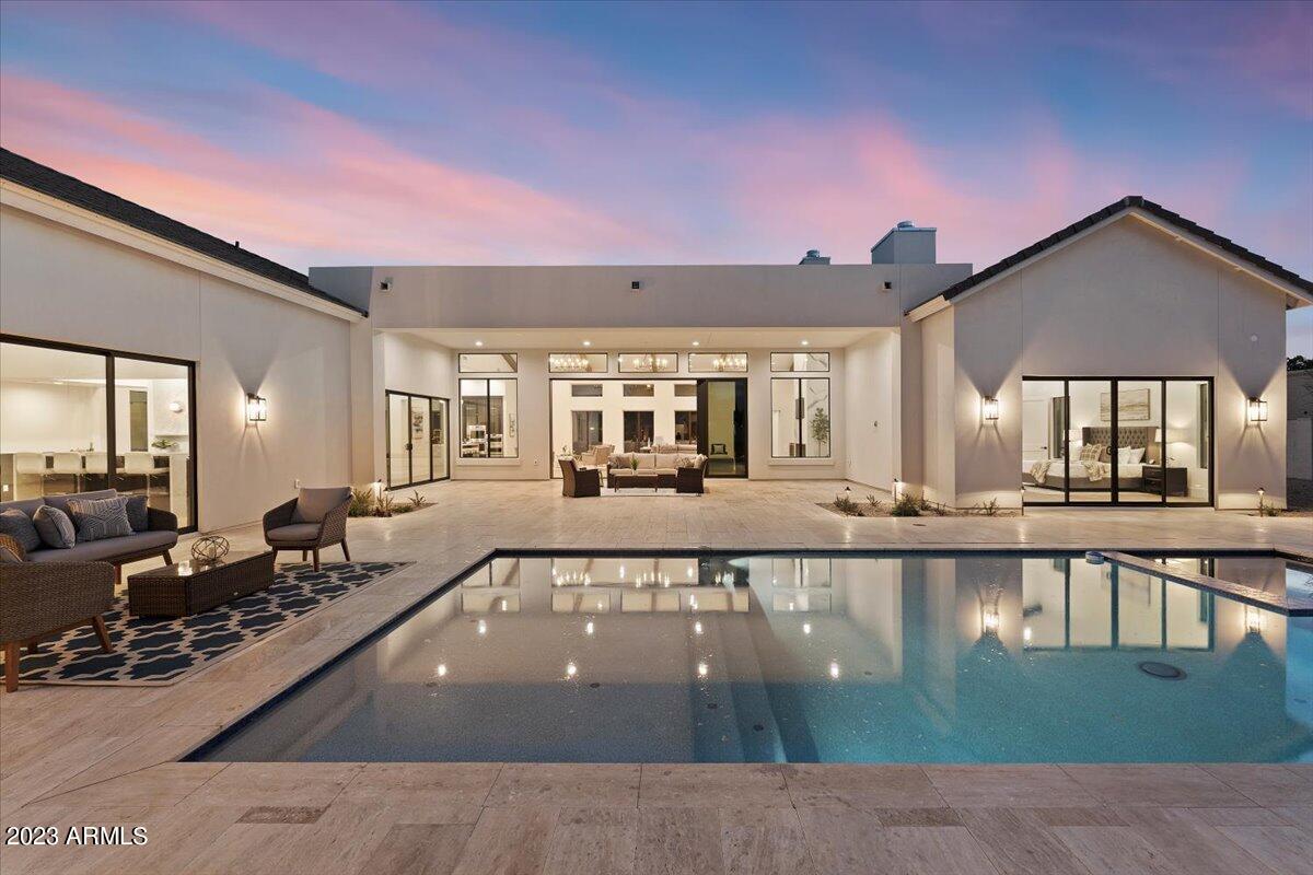 New Home, designed by Schmid Architects and Nomad Interiors. Lot size allows for additional Garages, Guest Home, Tennis, sport Court or putting green.  Featuring:
• Farmhouse Contemporary with top of the line finishes 4 car garage with Gated motor court
• 2 x 6 fire treated lumber construction
• Full synthetic smooth* stucco exterior with wood fascia, and T & G overhang roof deck
• Fire Sprinklers throughout
• Open Cell spray foam at exterior wall, attic, garage walls and roof deck. Batt insulation
at interior sound walls. Poly seal weep screed at exterior windows and doors
• Custom ceiling details with actual solid rough sawn wood beams at Great Room, Dining,
Family Room and Master Bedroom
• PRL and Milgard Aluminum window frame pane low-E windows and exterior doors
- see MOTION " Large multi slider 12-foot glass wall in Great Room" Large 8 ft multi slider at dining room, family room and master bedroom
" Trane Seer variable speed multi -zoned AC/heat pump system with control integration
and single stage system at Master bedroom. Two 5 ton, one 4 ton and one 3-ton units and one wine guard HVAC units.
" Structured wiring and panel including integrated Home Wi-Fi System
" Full Home Security System Integrated Control prewire (motion and security alarm prewire)
" Orginal acoustics in ceiling speaker with thin bezel woofer and dome tweeter at Great room, Kitchen, Family room Dining room, Master bedroom and Master bath. Family room includes episode passive in wall subwoofer with dual 8 in woofers.
" Multimedia outlets CAT6 and RG6 throughout
" Prewire for video distribution, device control and automation throughout including Pool and patio locations
" Control 4 Automated Lighting System
" Natural gas at numerous locations (Range, Water Heaters, BBQ, Fireplace, Firepits, Pool/Spa).
" Engineered hardwood floors throughout (no carpet)
" 8 ft solid core shaker doors throughout
" Insulated 4 car garage door
" Custom cabinets with soft close drawers and doors
" Porcelain, Quartz and Marble counter tops at kitchen, Bar, Laundry, Pantry, Powder and baths, include waterfall details at Kitchen Bar and a bathroom location.
" Wine Room with wine refrigeration HVAC System and custom racking
" Subzero/Wolf/Cove appliances - Wolf 48" sealed burner range top with 6 burner and infrared griddle, Wolf 30" E Series professional built in double oven, Wolf 30" E series transitional drop-down door microwave oven, Sub-Sero 30" designer column - panel ready refrigerator, Sub-Zero 30" Designer Column -panel ready Freezer with Ice Maker, Wolf 30" Warming Drawer, Cove Dishwasher and Wolf 30" E series Professional Convection Steam wall oven.
" Multiple tankless gas water heaters with recirculating loops.
" Isokern gas fireplace in great room and Superfire fireplace master bedroom
" High end light fixtures
" Freestanding master tub and Bathroom 5 tub
" Ceramic and marble tile showers and floors in all 5 bathroom
" High end plumbing fixture throughout
" Extensive custom tile work at master bath and all secondary bathrooms (floors, showers, and surrounds).
" Separate His and Her master closets with cabinet system and washer/dryer hookup.
" His and Her toilets at master bath
" Mud room with built cubbies.
" Under counter mounted sinks at baths
" Paver driveway, front porch, front patio and rear patio.
" Travertine pool deck and patio floor
" Fire pit feature at pool area.
" Built in Coyote barbeque, side burner rear yard.
" New custom pool/spa with in floor cleaning.
" Custom front and rear landscaping with automatic irrigation system
Square footage:
6,572 Livable square feet - 1,197 sqft of 4 car garage; 896 sqft of Covered patio
9,980 Total square feet under roof (including overhangs) room to add additional Structure or Sporting features